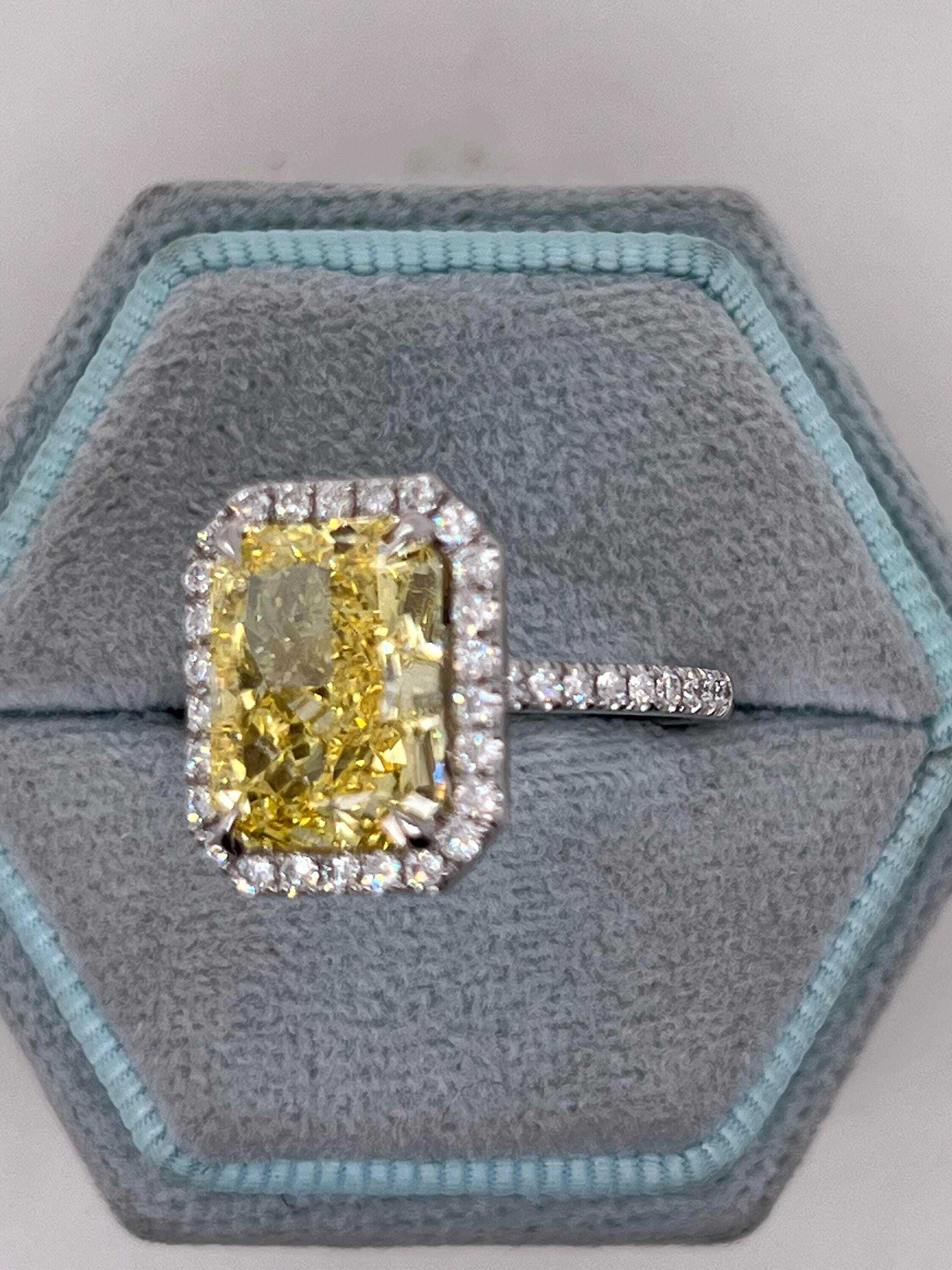 5.5 Carat Total Fancy Vivid Yellow Elongated Radiant Cut Diamond Halo Engagement Ring