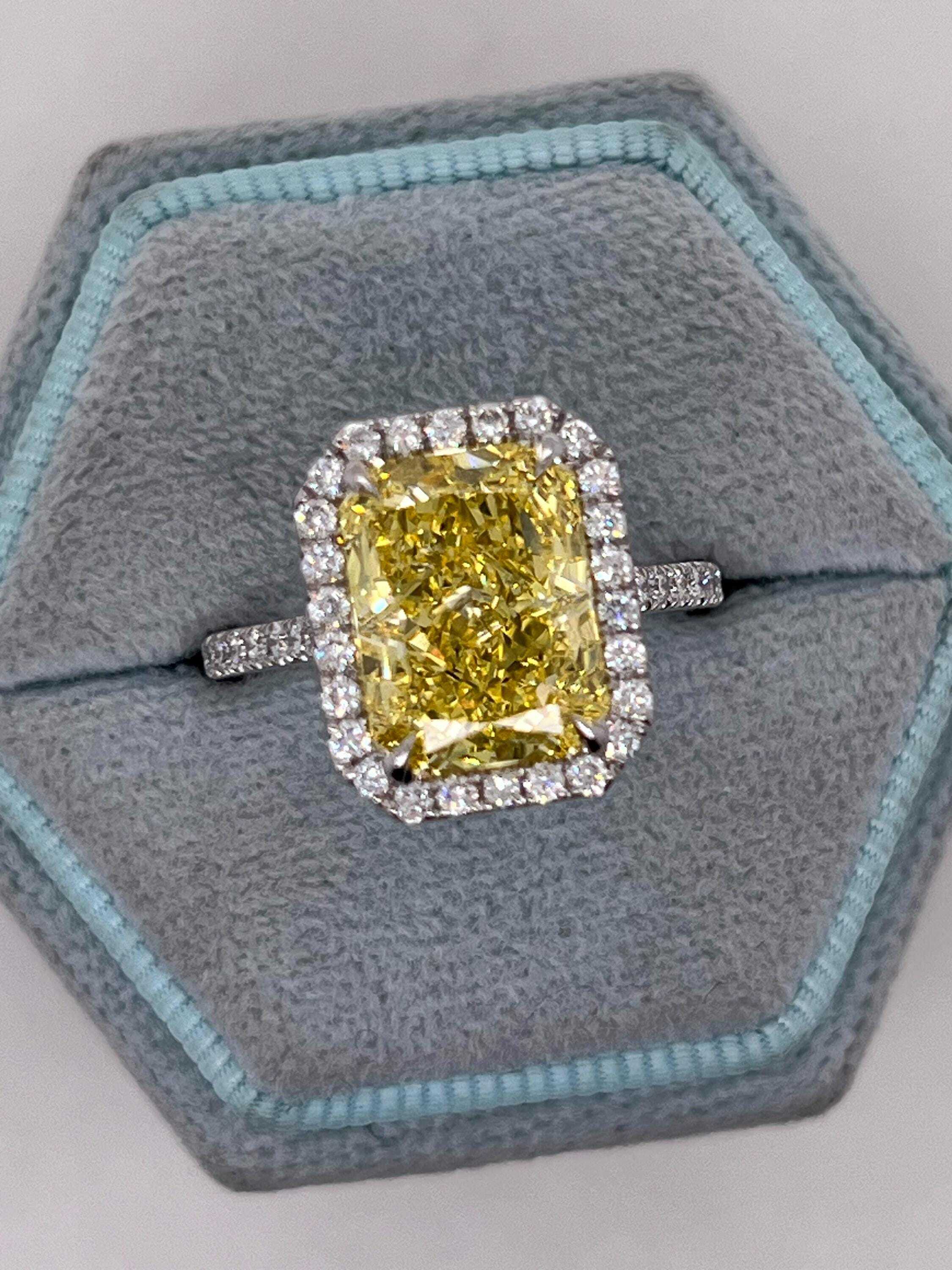 5.5 Carat Total Fancy Vivid Yellow Elongated Radiant Cut Diamond Halo Engagement Ring