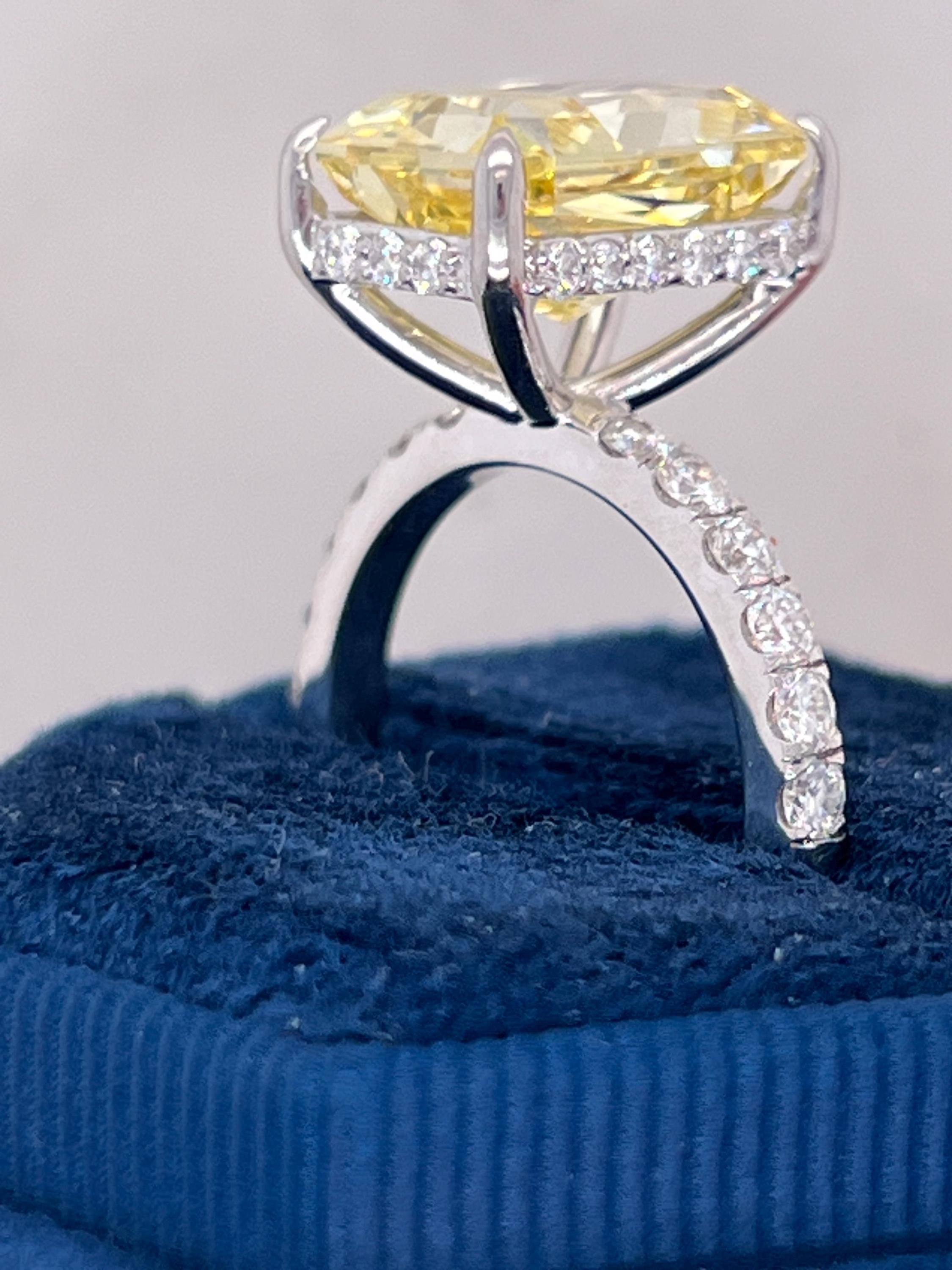 7.25 Carat Total Fancy Vivid Yellow VVS1 Clarity Elongated Radiant Cut Diamond Hidden Halo Engagement Ring