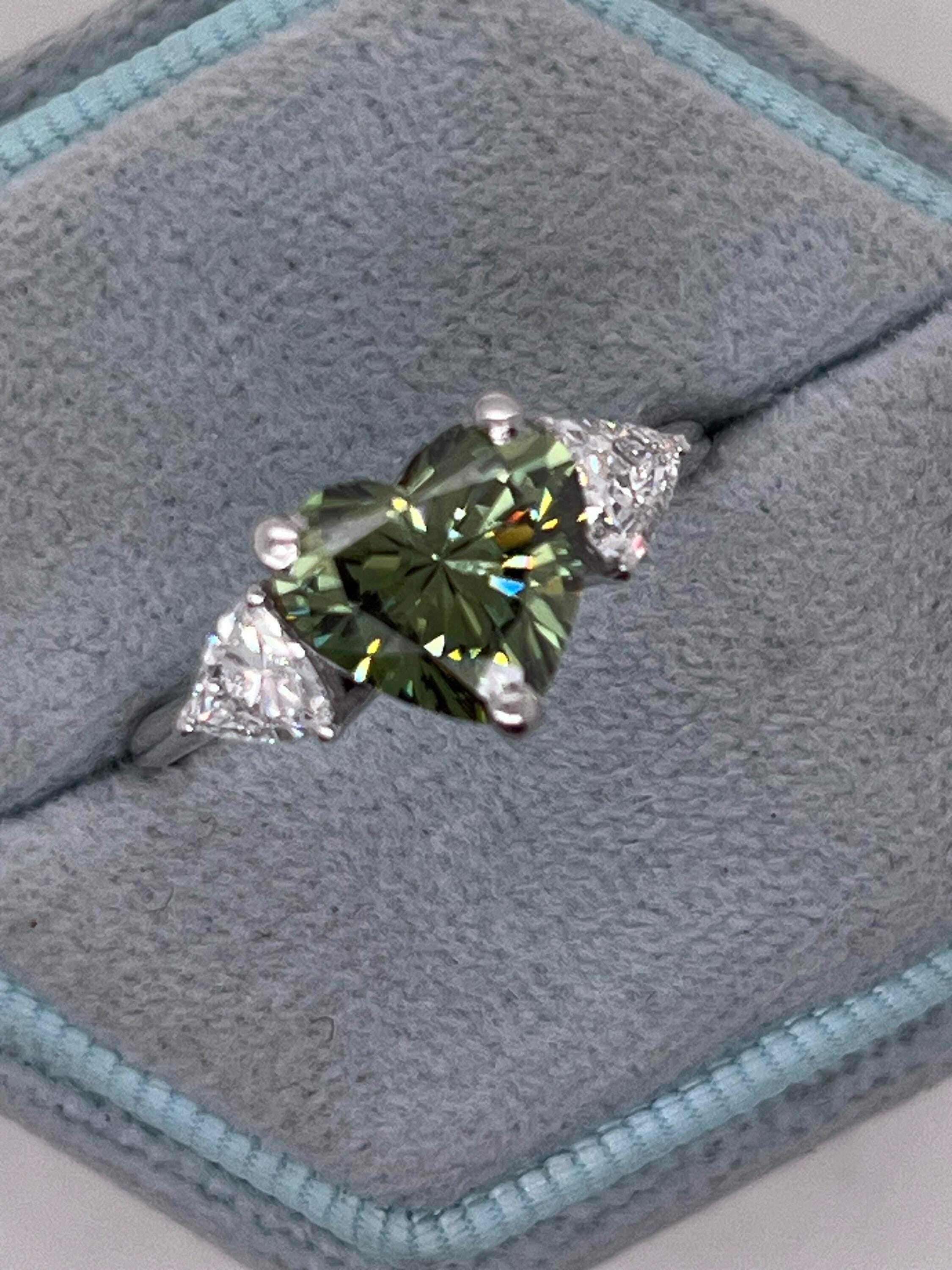 2.75 Carat Fancy Vivid Green Heart Cut Diamond Three Stone Engagement Ring Side Trillions