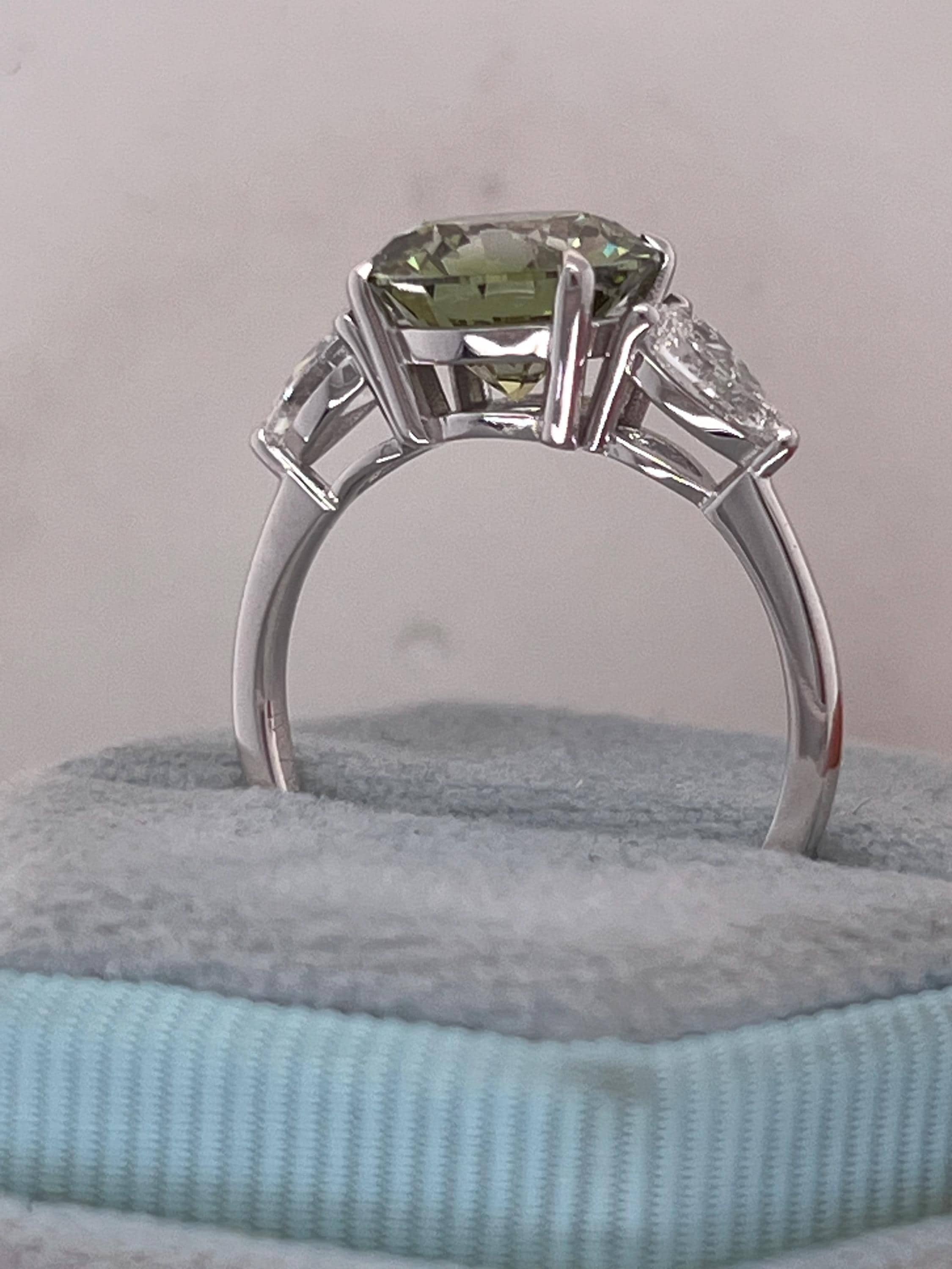 3.5 Carat Fancy Vivid Green VVS1 Clarity Round Cut Diamond Three Stone Engagement Ring Side Pears