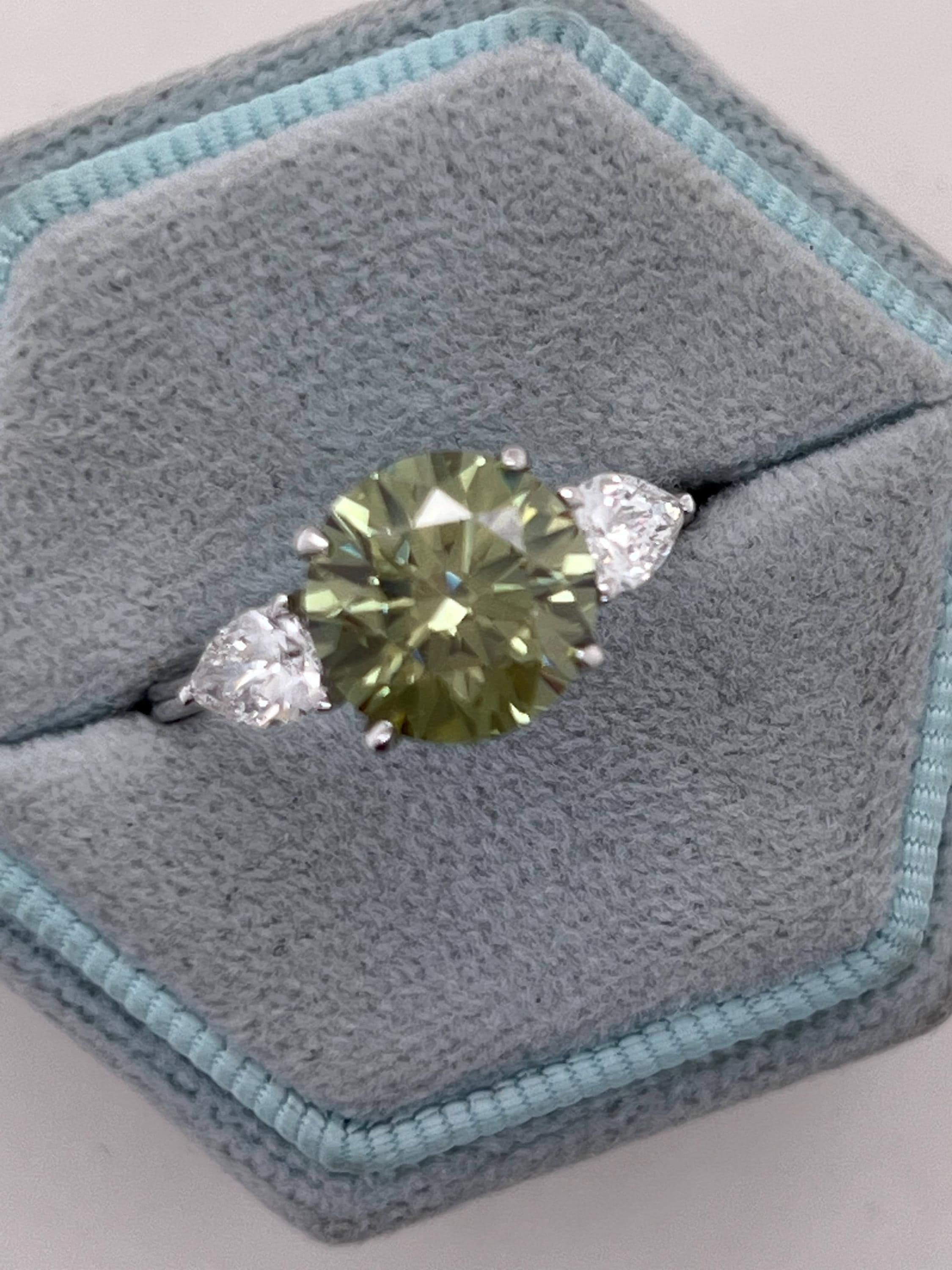 3.5 Carat Fancy Vivid Green VVS1 Clarity Round Cut Diamond Three Stone Engagement Ring Side Pears