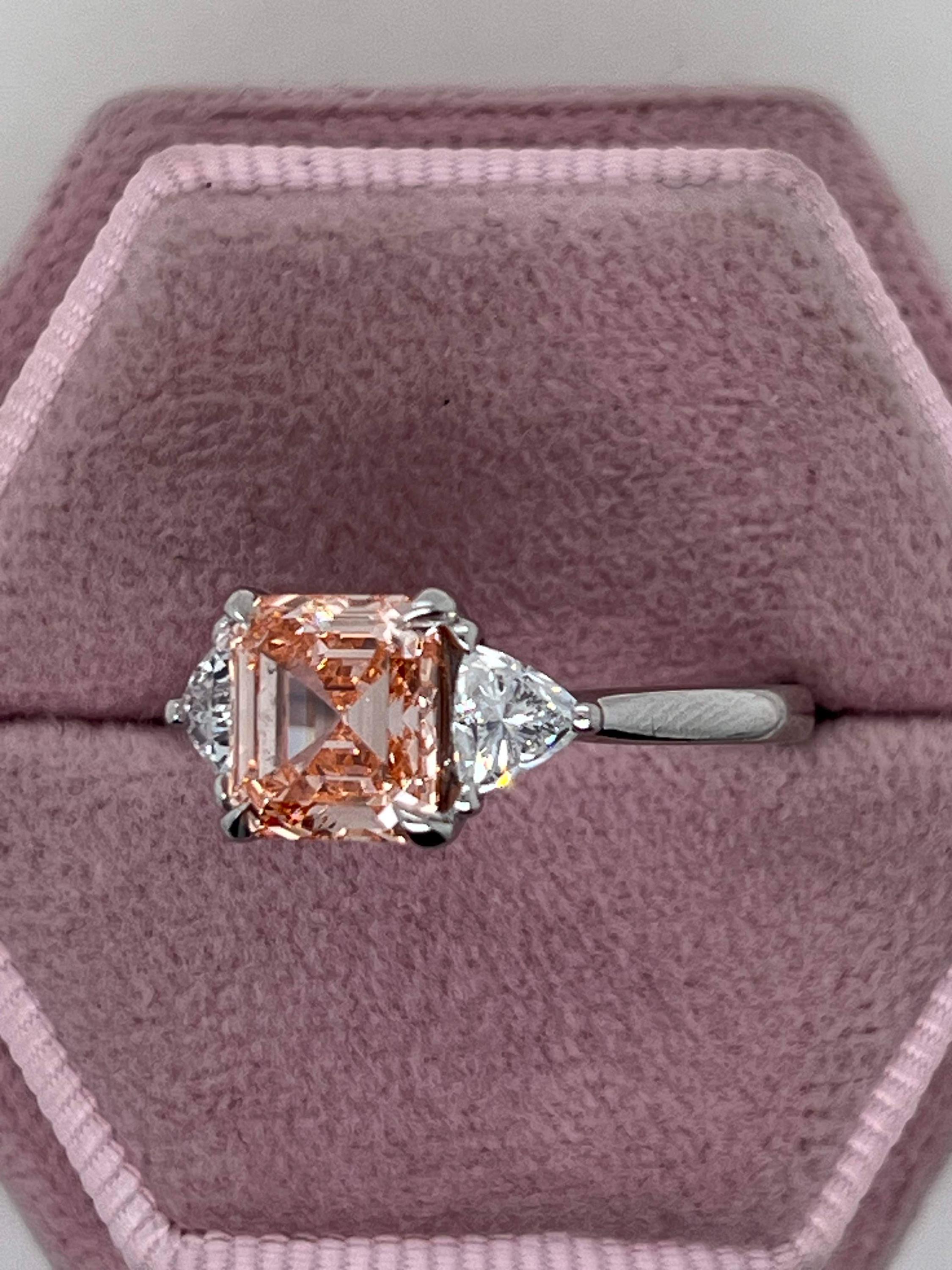 2.5 Carat Fancy Vivid Pink Asscher Cut Three Diamond Engagement Ring Side Trillions