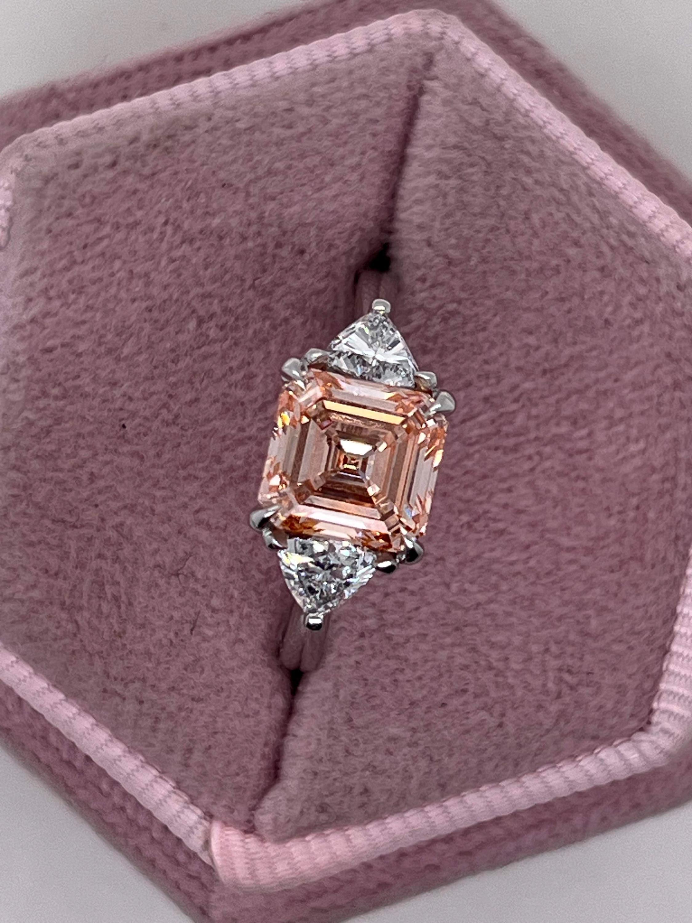 2.5 Carat Fancy Vivid Pink Asscher Cut Three Diamond Engagement Ring Side Trillions