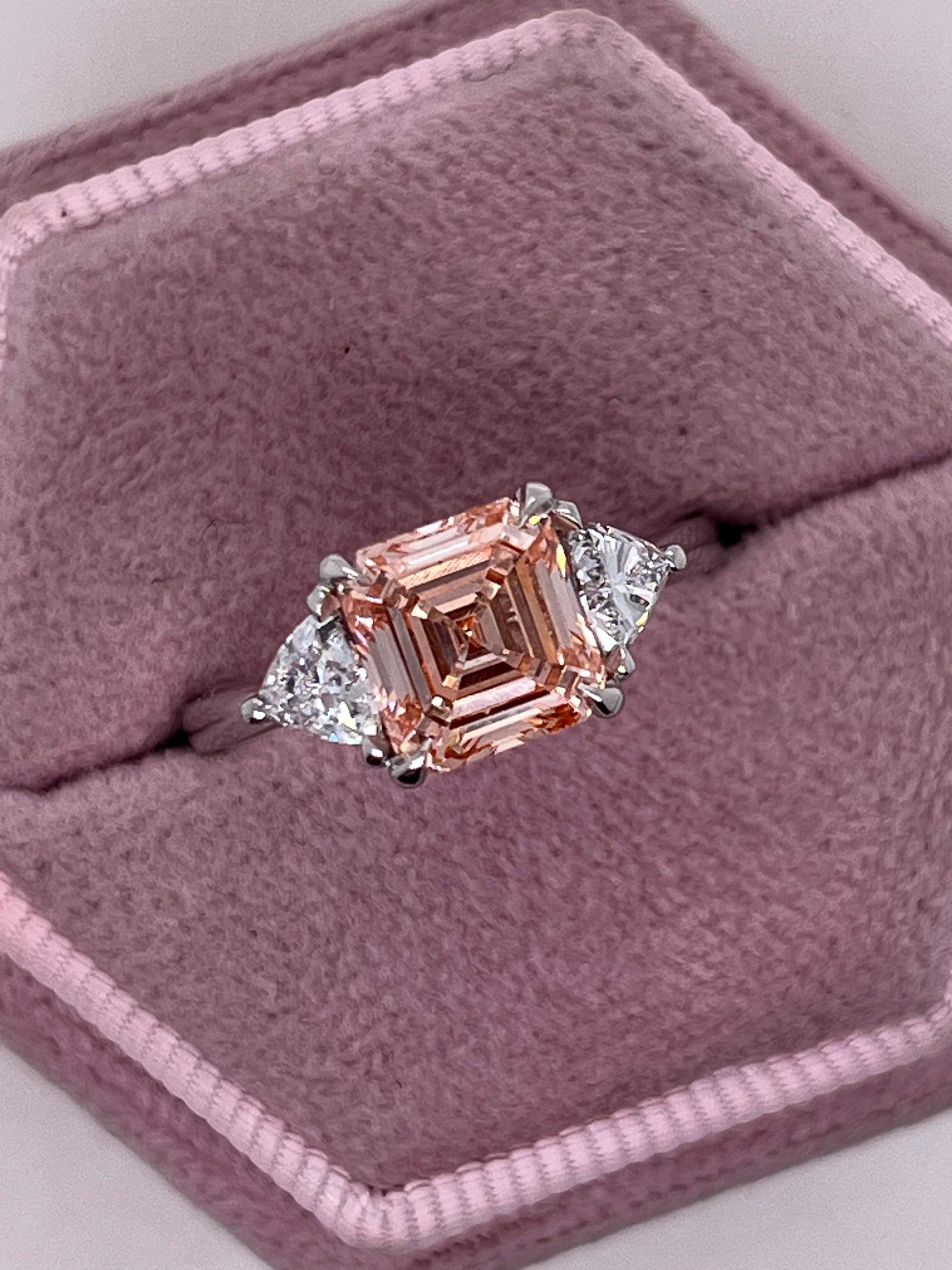 2.5 Carat Fancy Vivid Pink Asscher Cut Three Diamond Engagement Ring Side Trillions