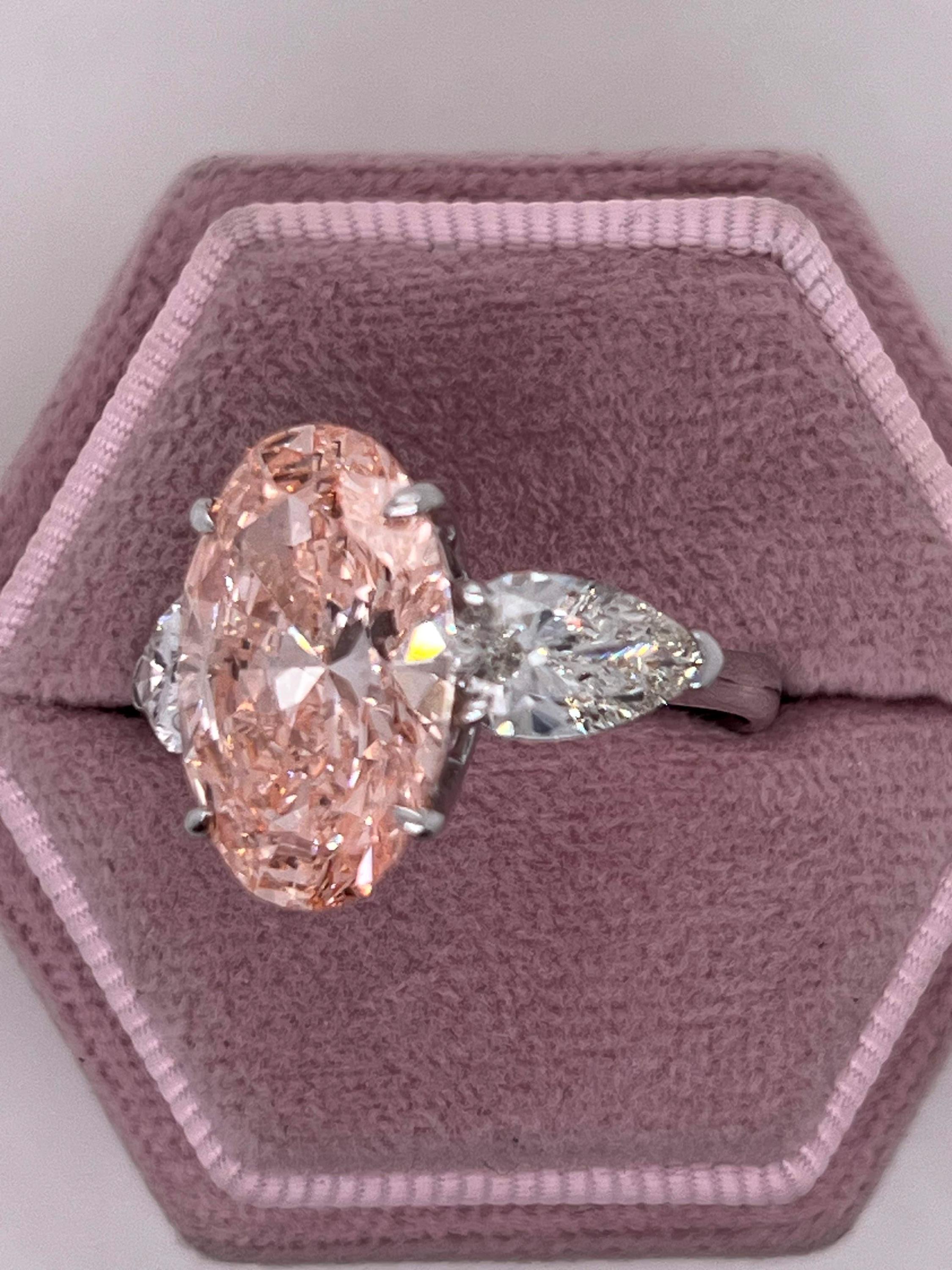 9 Carat Total Fancy Vivid Pink Oval Cut Three Stone Engagement Ring, Side Pear Diamonds