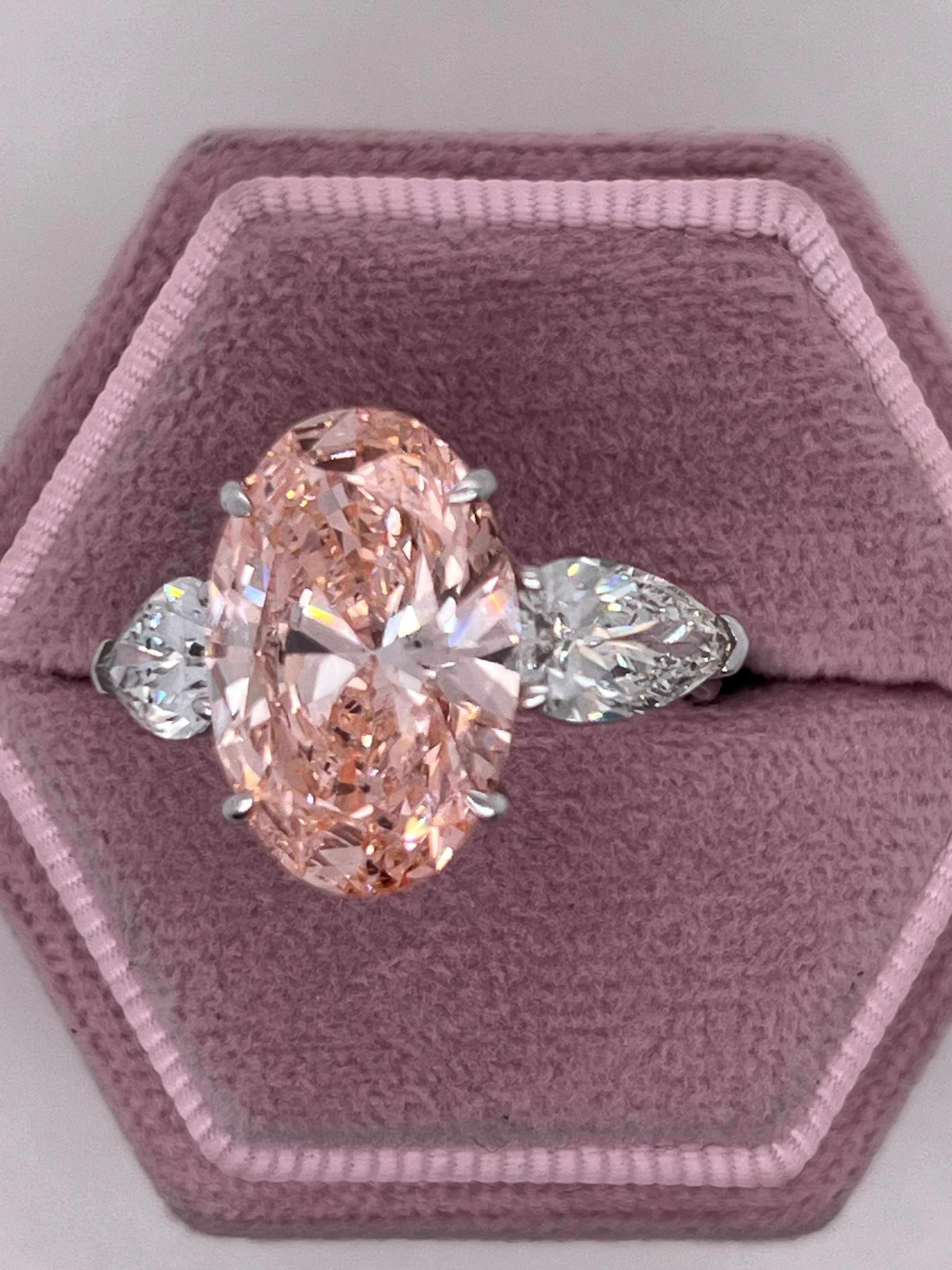 9 Carat Total Fancy Vivid Pink Oval Cut Three Stone Engagement Ring, Side Pear Diamonds
