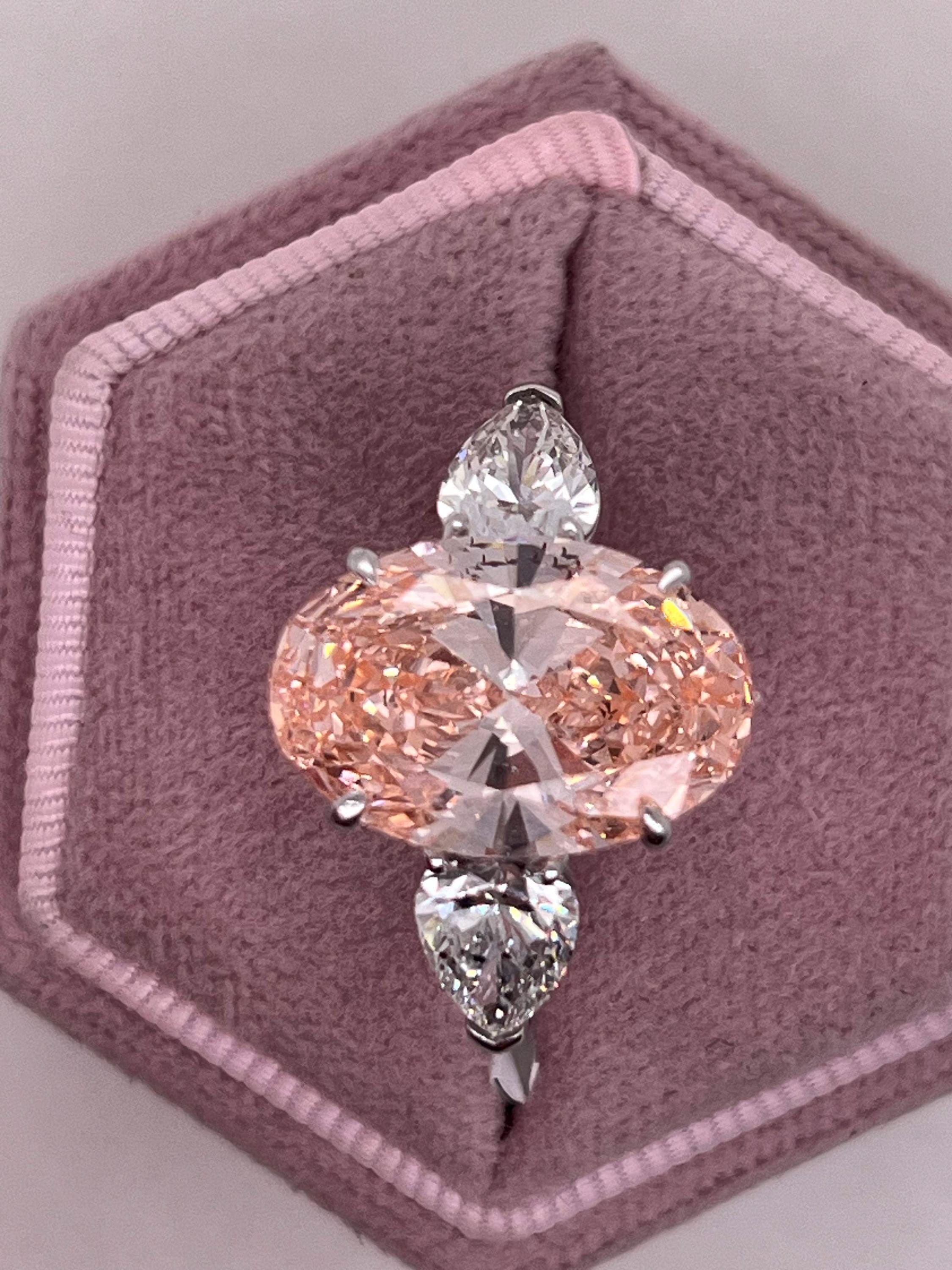 9 Carat Total Fancy Vivid Pink Oval Cut Three Stone Engagement Ring, Side Pear Diamonds