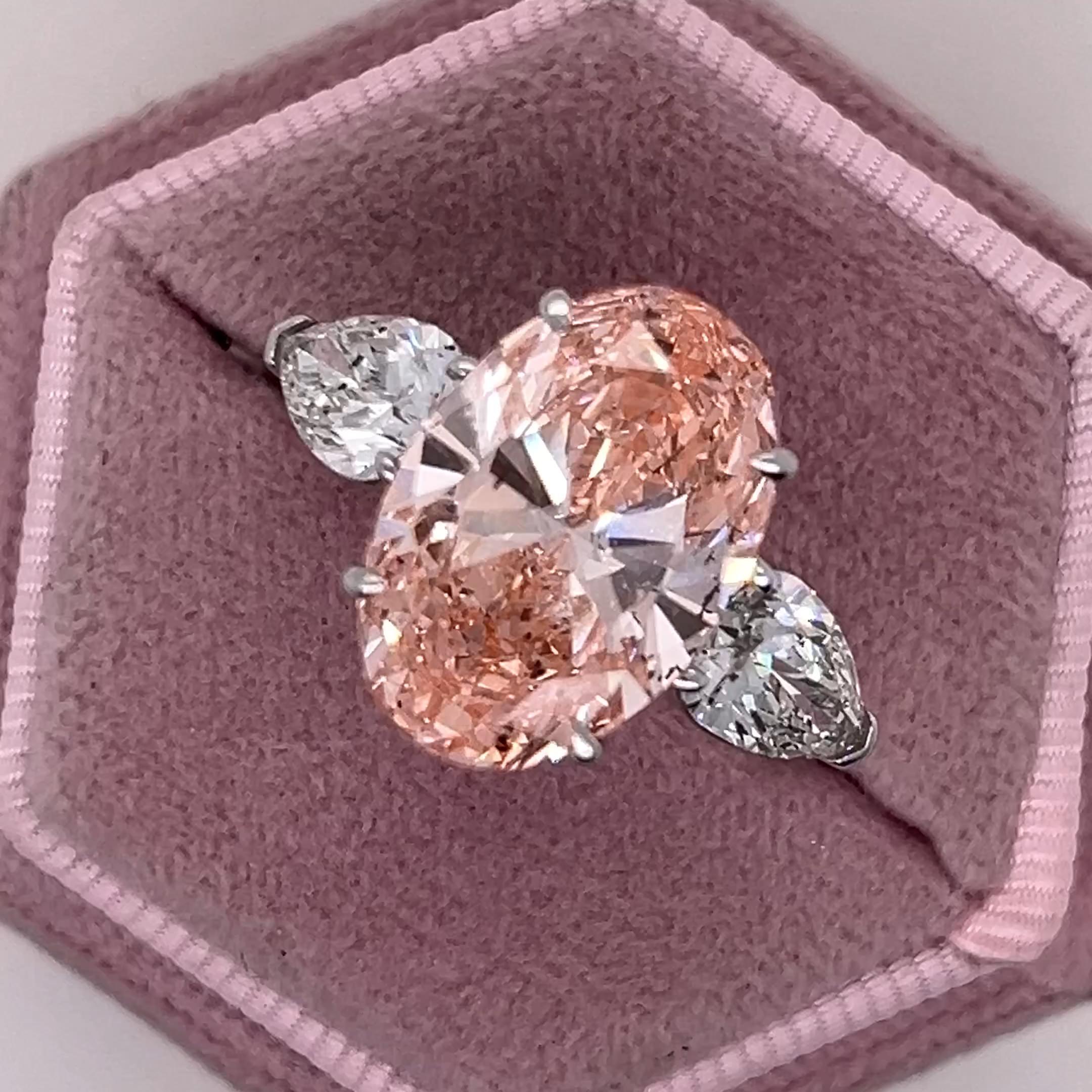 9 Carat Total Fancy Vivid Pink Oval Cut Three Stone Engagement Ring, Side Pear Diamonds