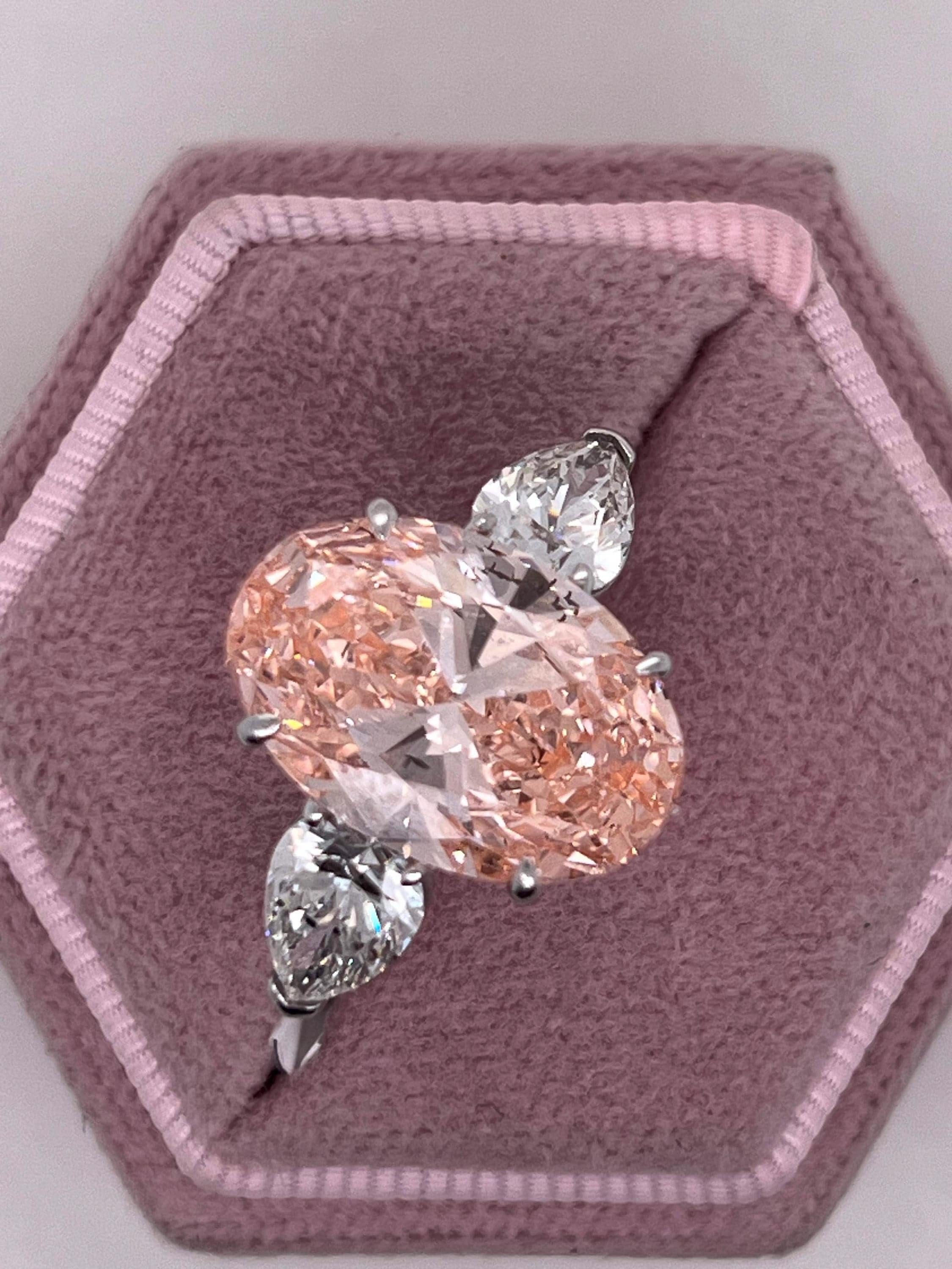 9 Carat Total Fancy Vivid Pink Oval Cut Three Stone Engagement Ring, Side Pear Diamonds