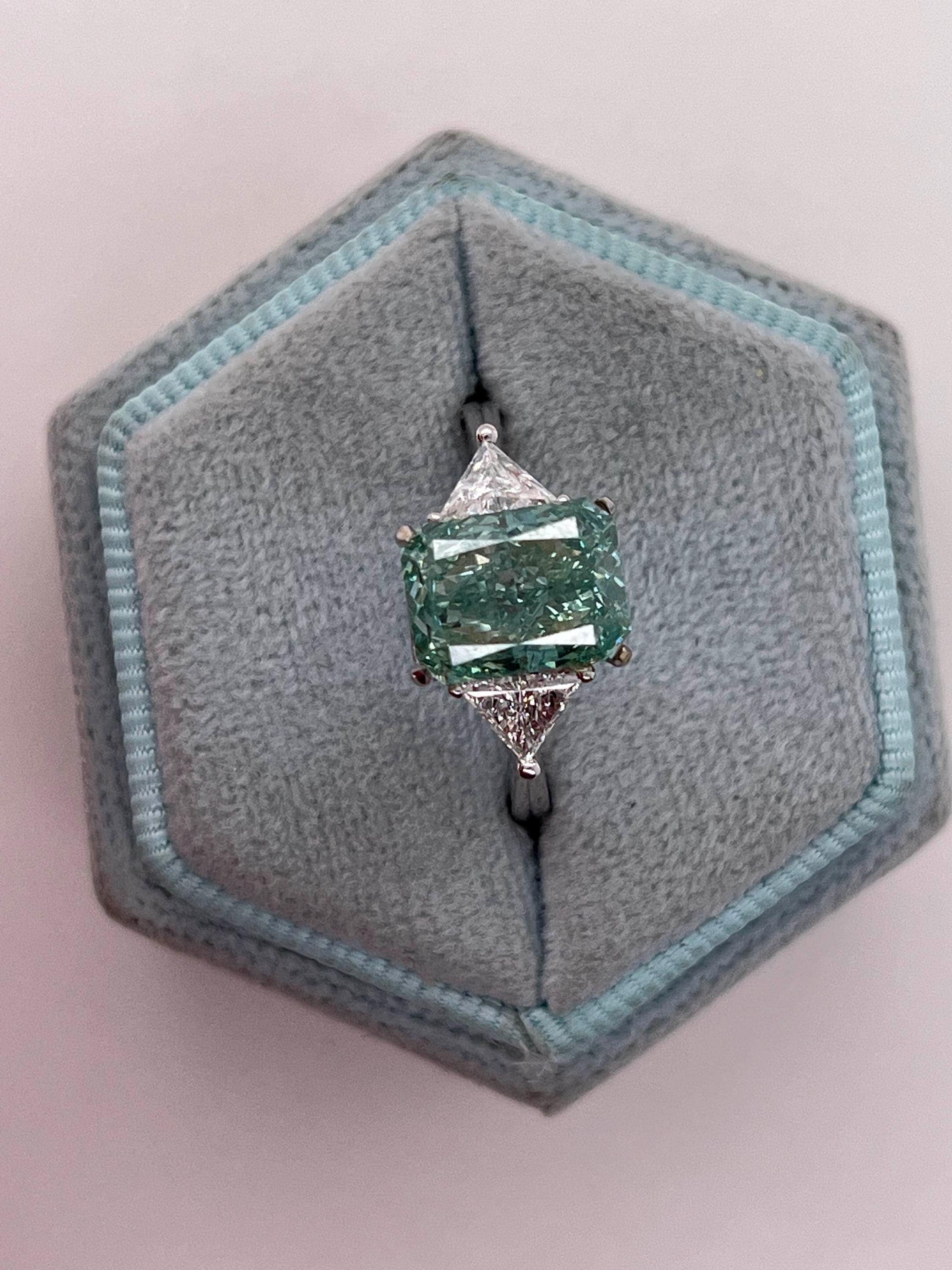 3.5 Carat Fancy Vivid Green Radiant Cut Diamond Three Stone Engagement Ring Side Trillions