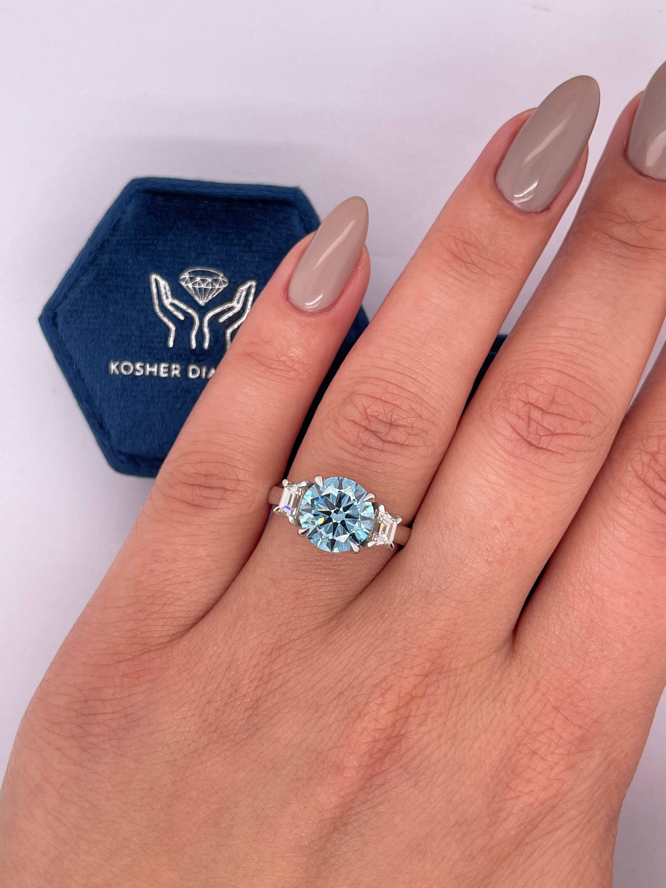 2.5 Carat Fancy Vivid Blue Round Cut Three Stone Diamond Engagement Ring, Side Trapezoid Diamonds