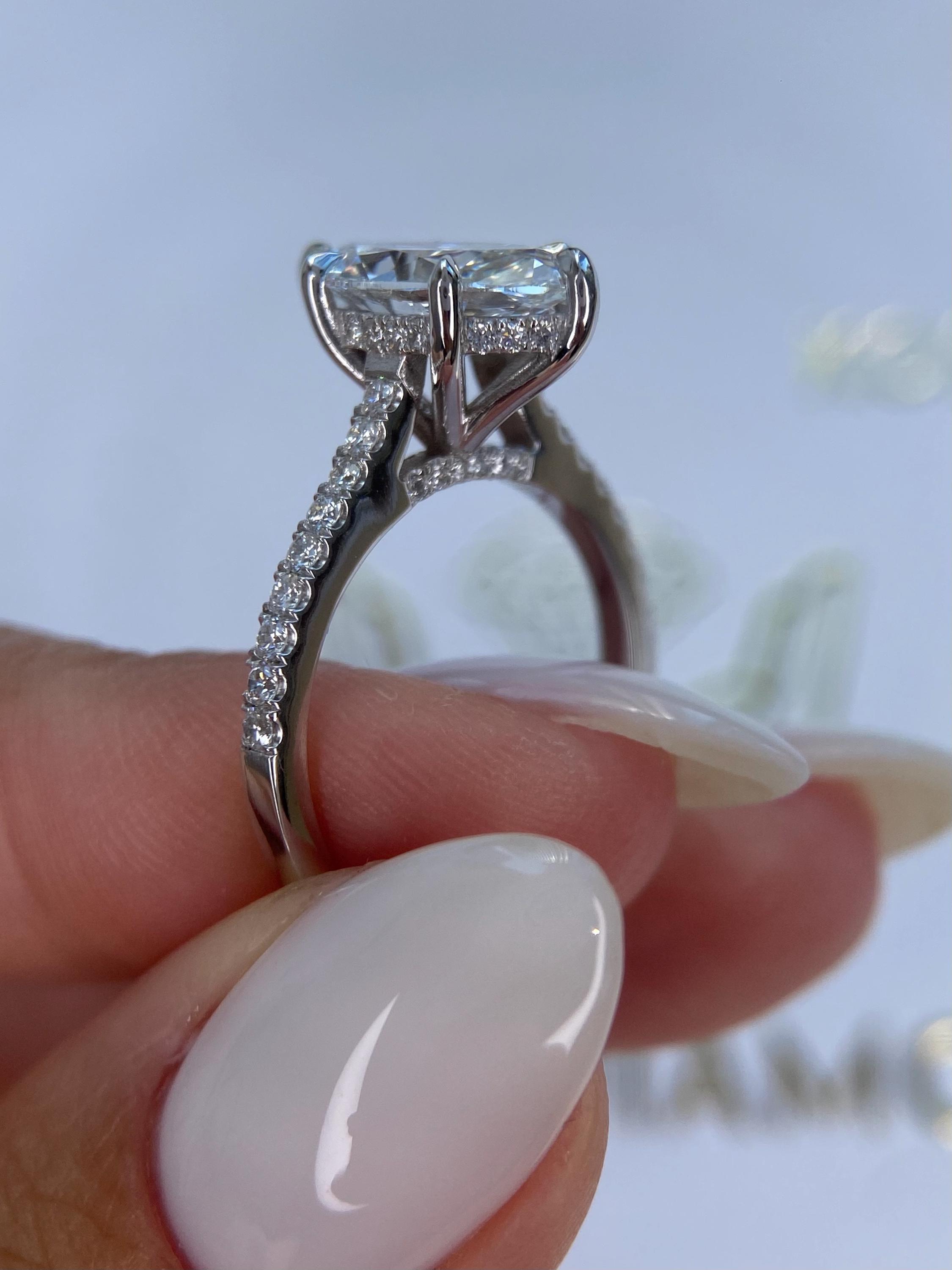 Unique 4.50 carat Marquise Cut Diamond Hidden Halo Cathedral Set Engagement Ring
