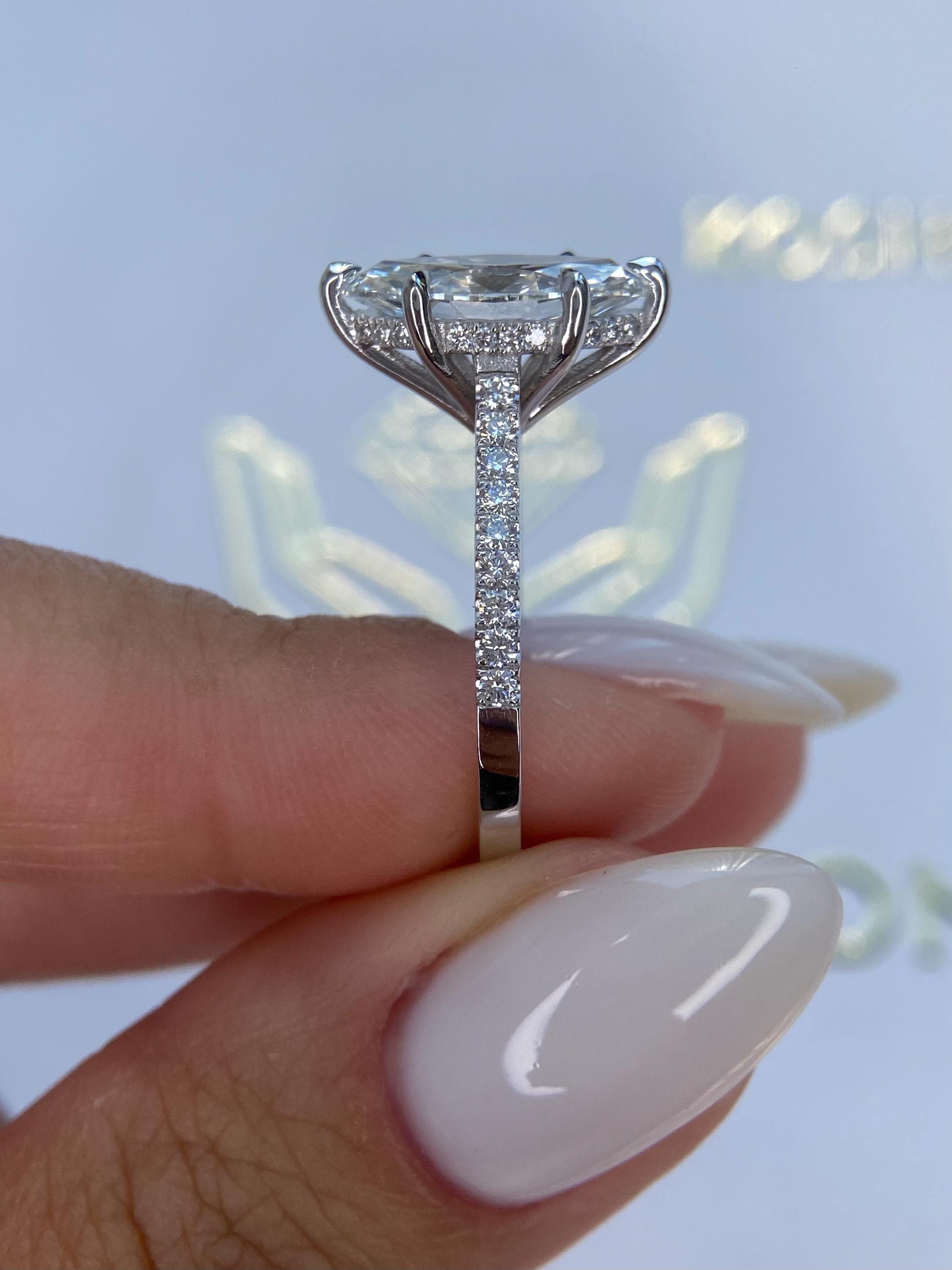 Unique 4.50 carat Marquise Cut Diamond Hidden Halo Cathedral Set Engagement Ring
