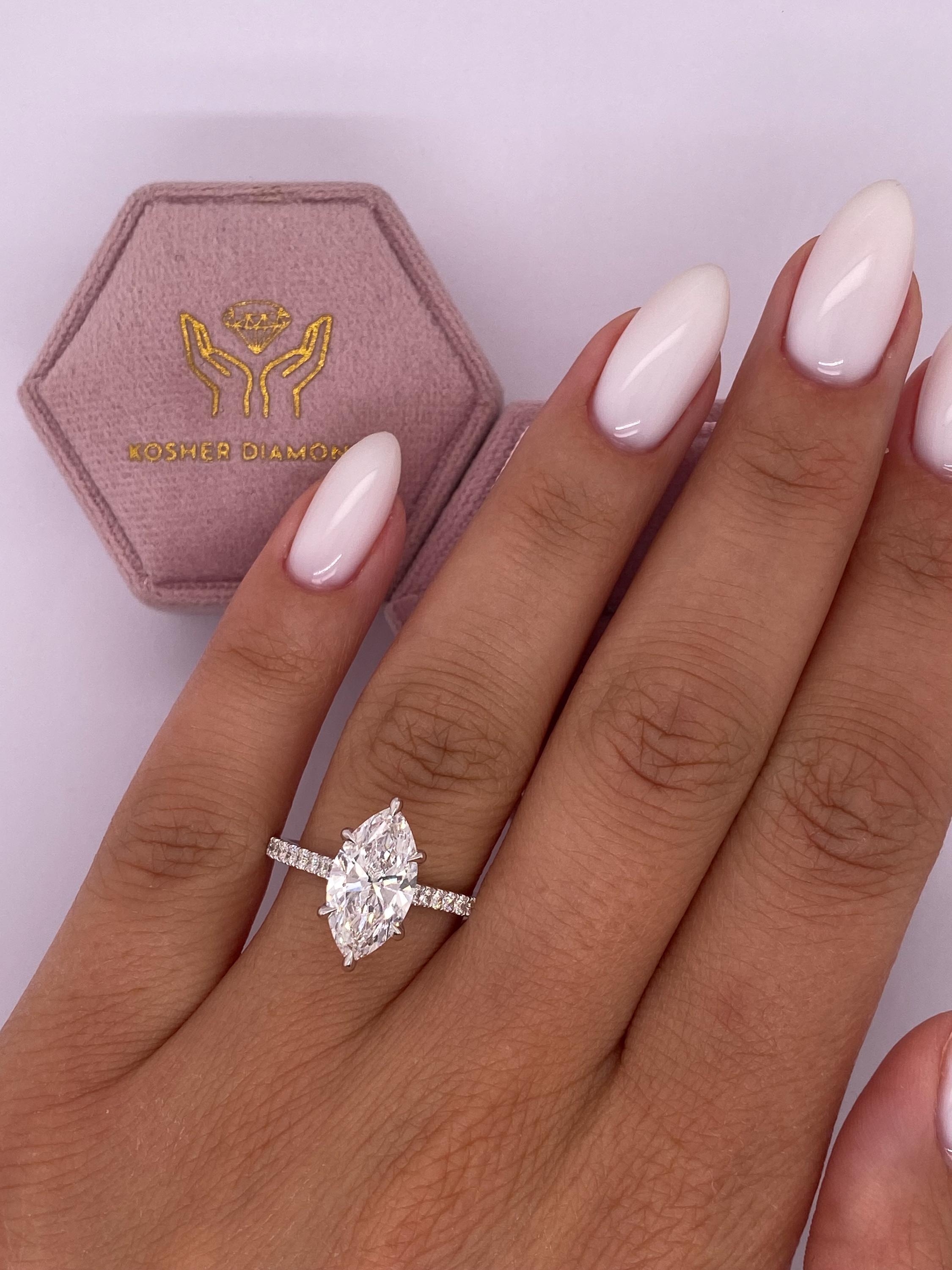 Unique 4.50 carat Marquise Cut Diamond Hidden Halo Cathedral Set Engagement Ring
