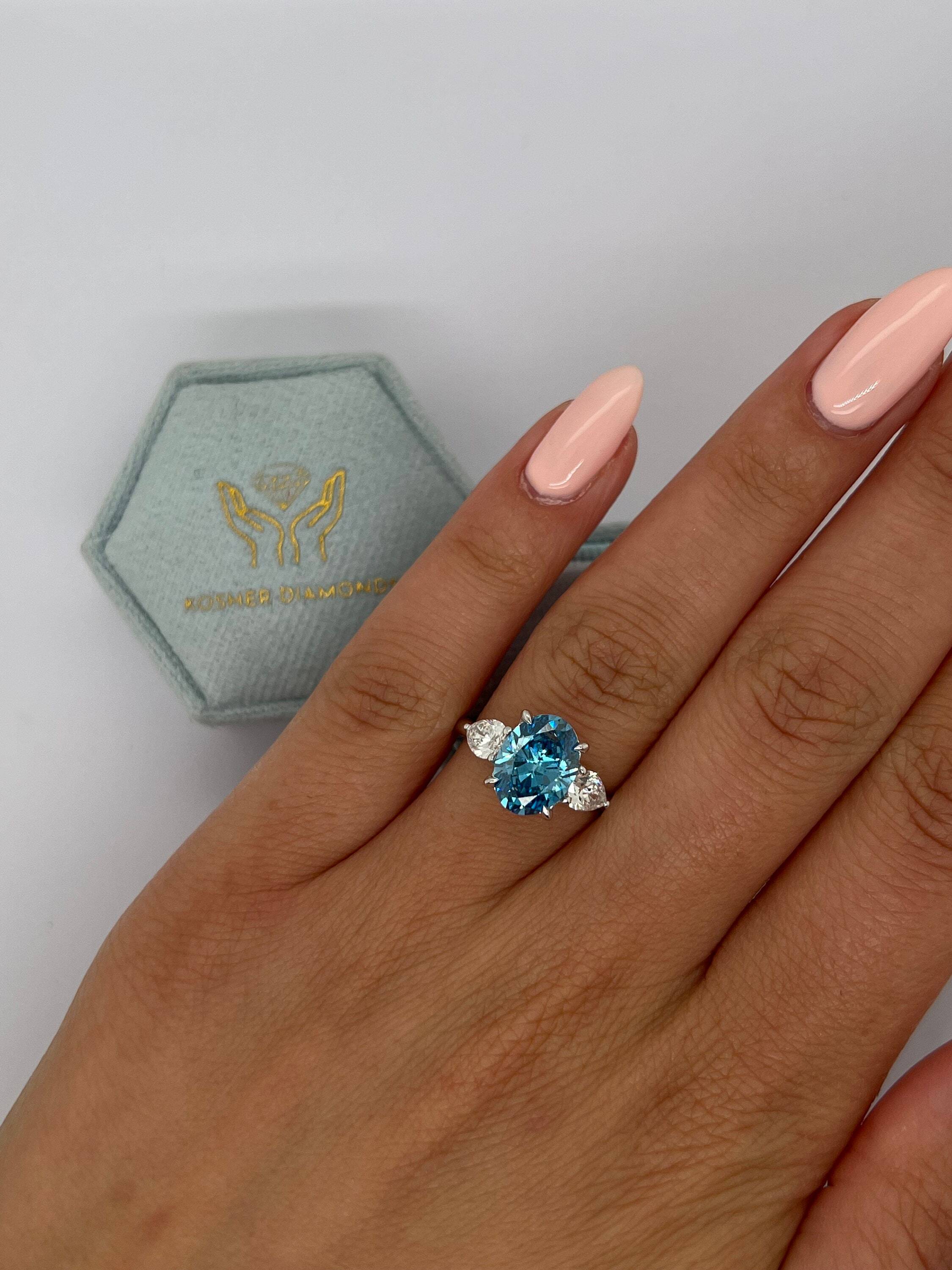 3.5 Carat Fancy Vivid Blue Oval Cut Three Stone Diamond Engagement Ring Side Pears