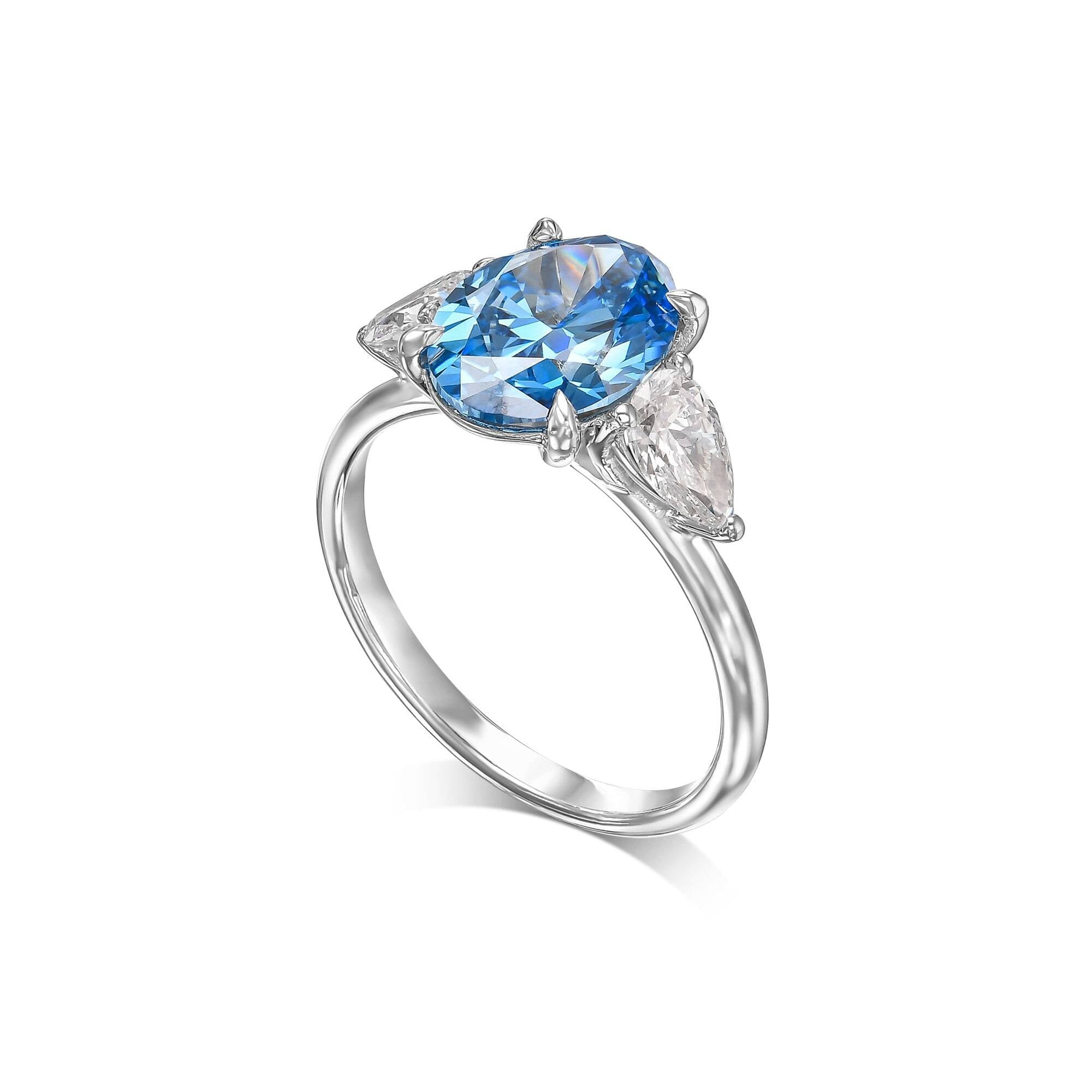 3.5 Carat Fancy Vivid Blue Oval Cut Three Stone Diamond Engagement Ring Side Pears
