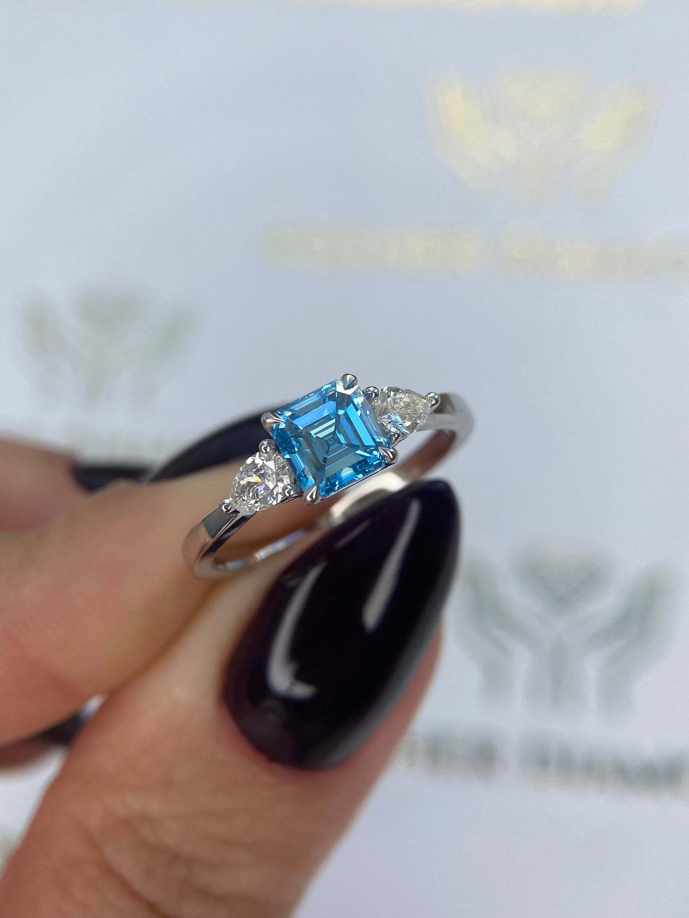 1.3 Carat Fancy Vivid Blue Asscher Cut Diamond Three Stone Engagement Ring, Side Pear Diamonds