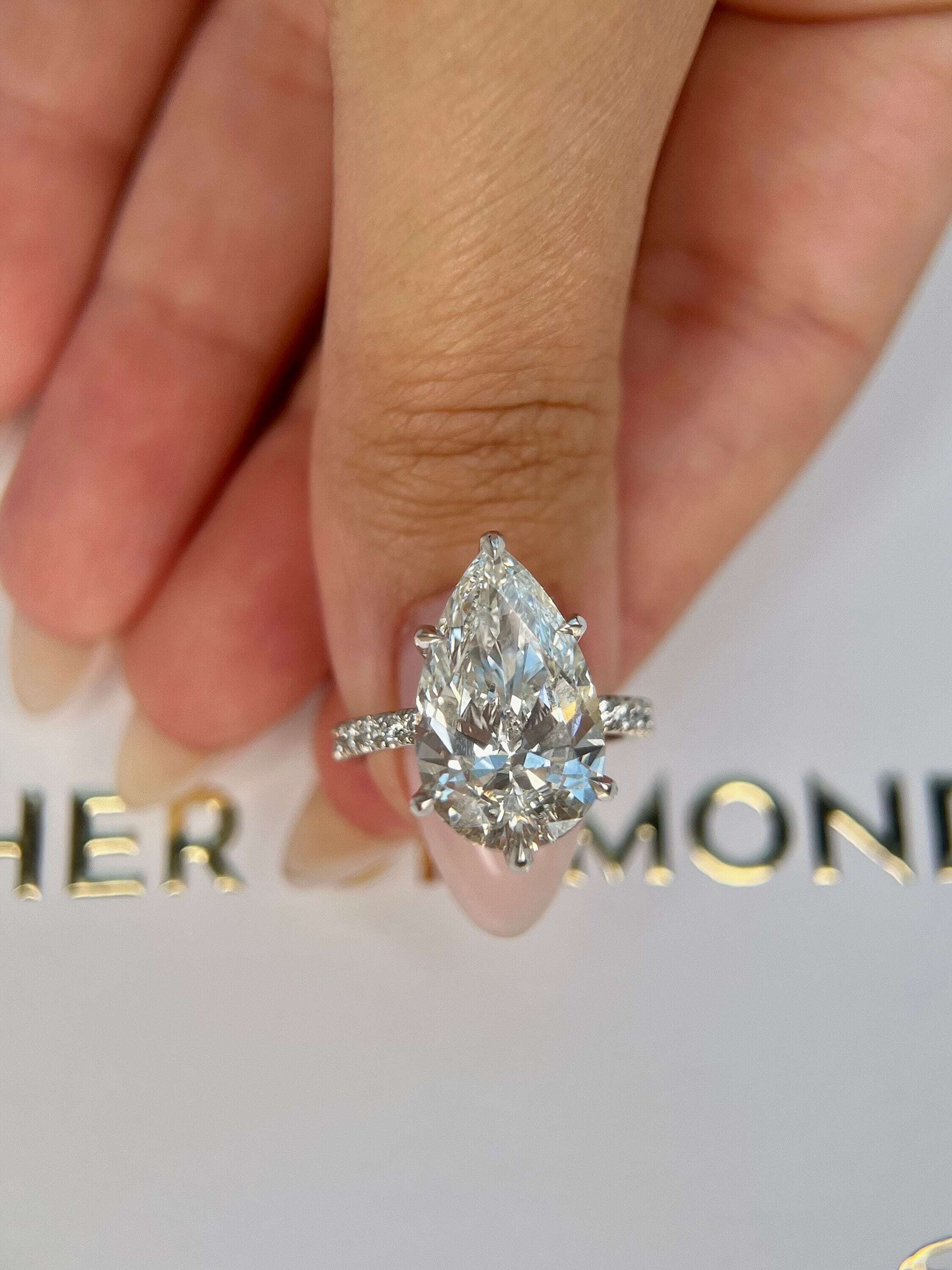 7.5 Carat Pear Cut Hidden Halo Diamond Engagement Ring with Pavé Diamonds