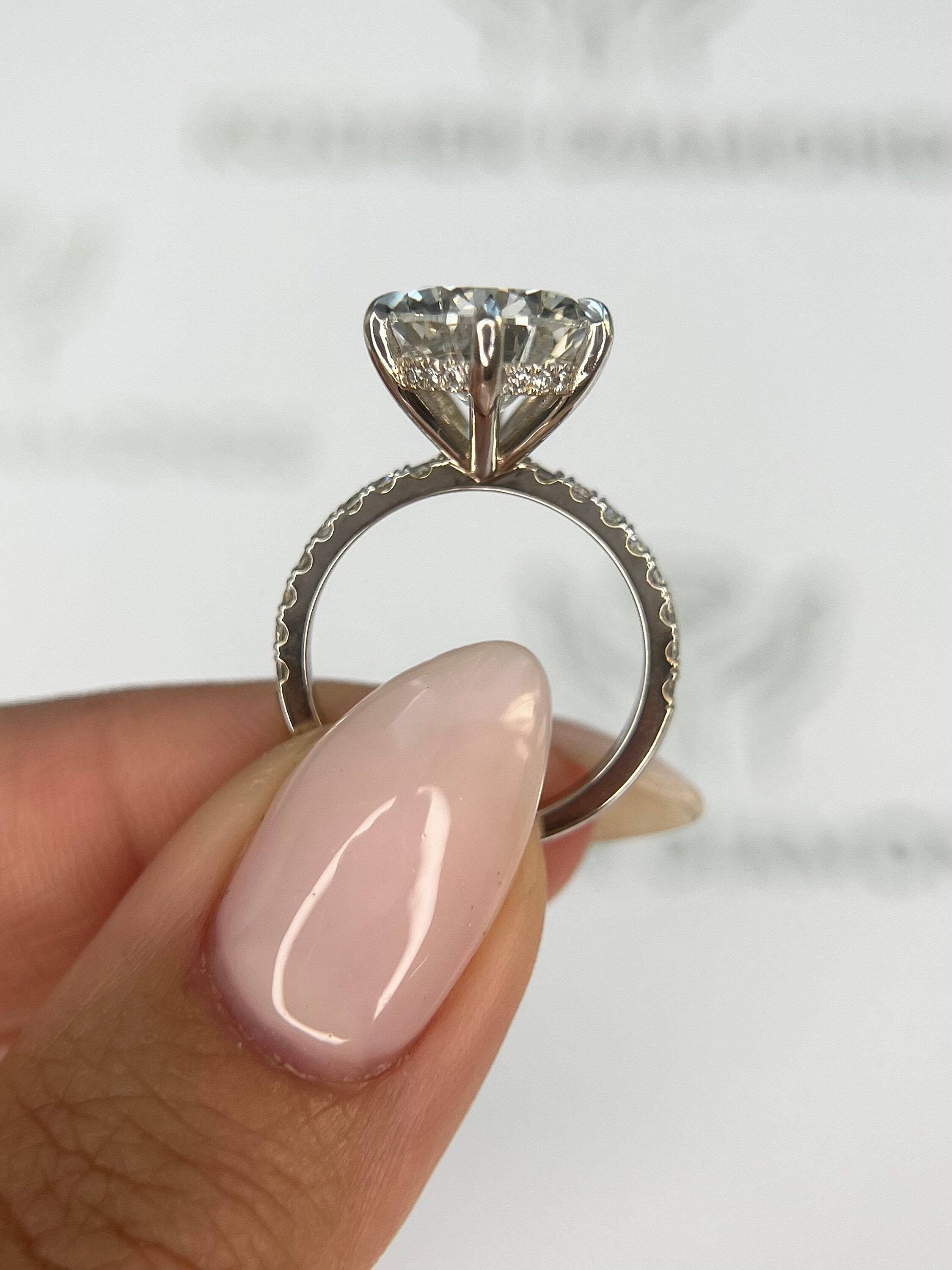 7.5 Carat Pear Cut Hidden Halo Diamond Engagement Ring with Pavé Diamonds