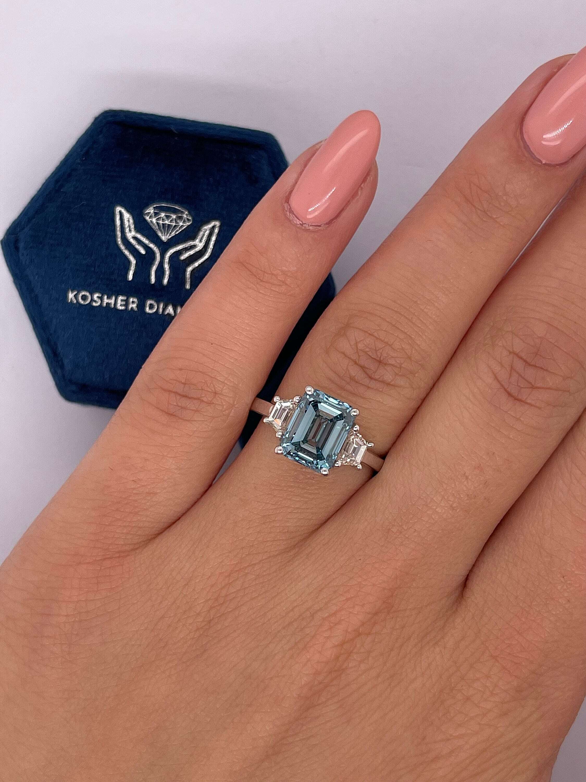3.5 Carat Fancy Vivid Blue Color Emerald Cut Three Stone Diamond Engagement Ring with Side Trapezoids