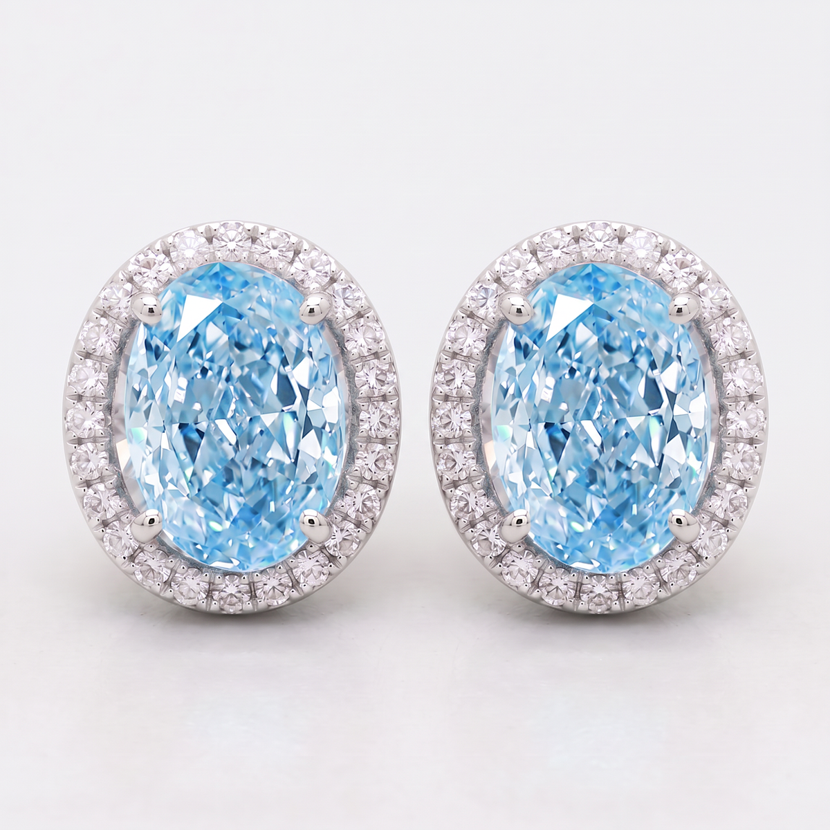 4.25 Carat Total Vivid Blue Oval Diamond Halo Earrings