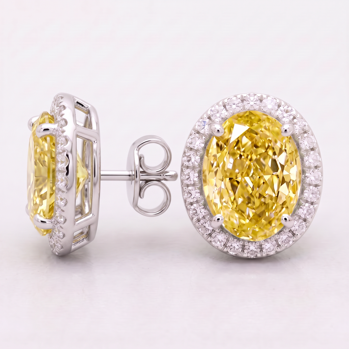 4.30 Carat Total Vivid Yellow Oval Diamond Halo Earrings