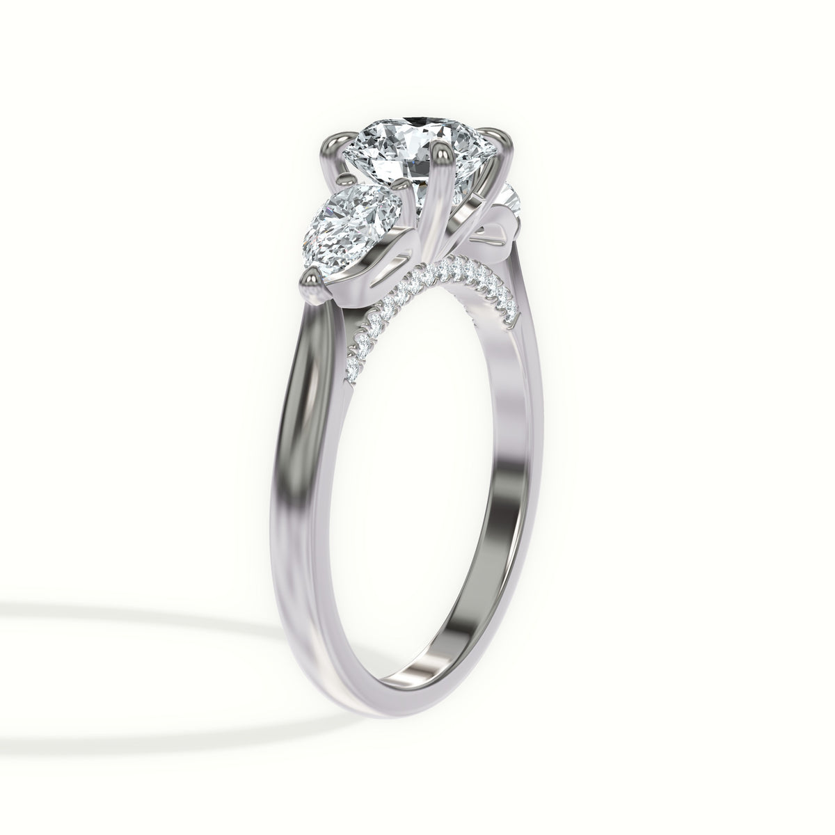 Sculpted Pear Three Stone Engagement Ring with Pavé Bridge