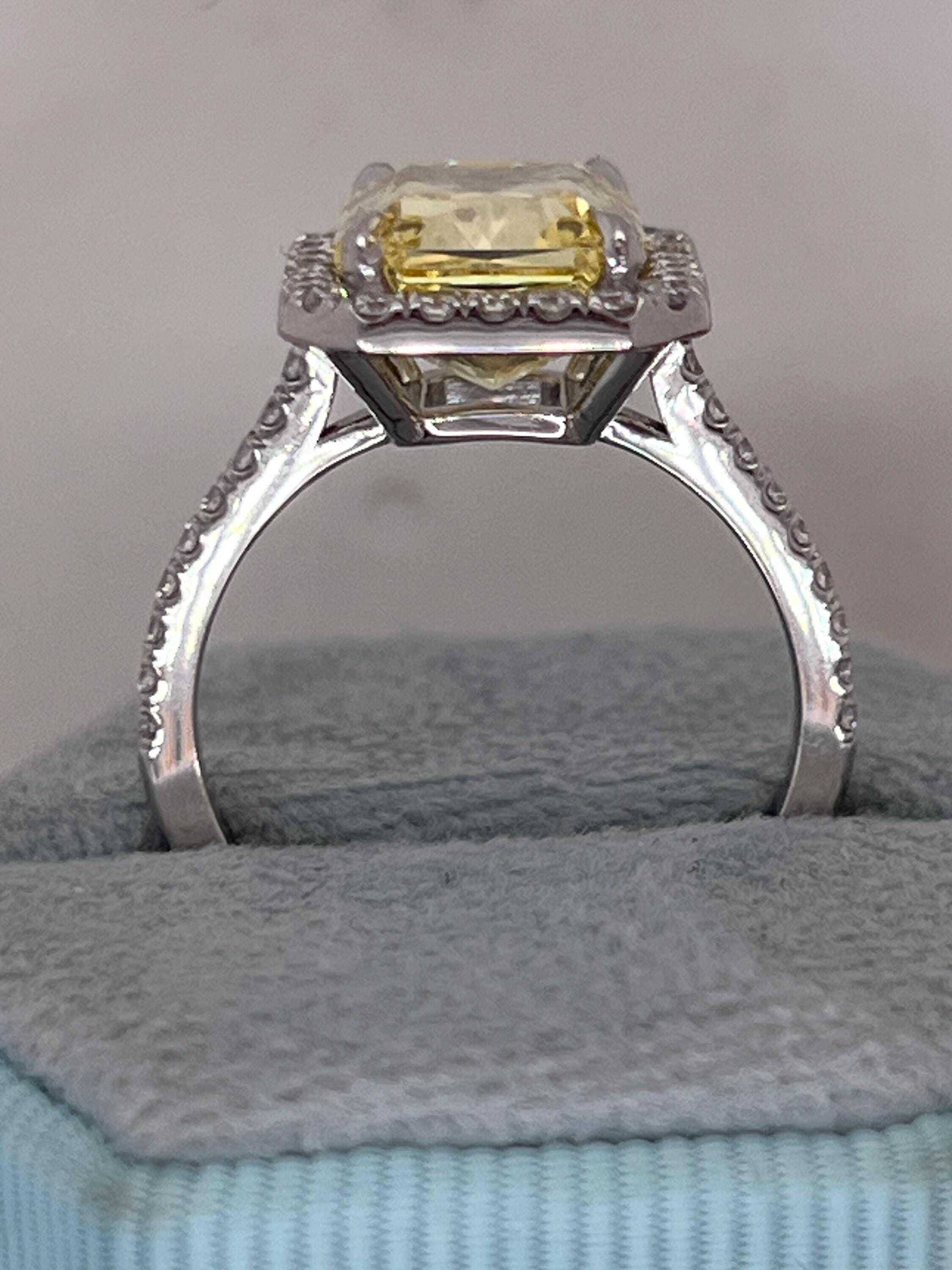 5.5 Carat Total Fancy Vivid Yellow Elongated Radiant Cut Diamond Halo Engagement Ring