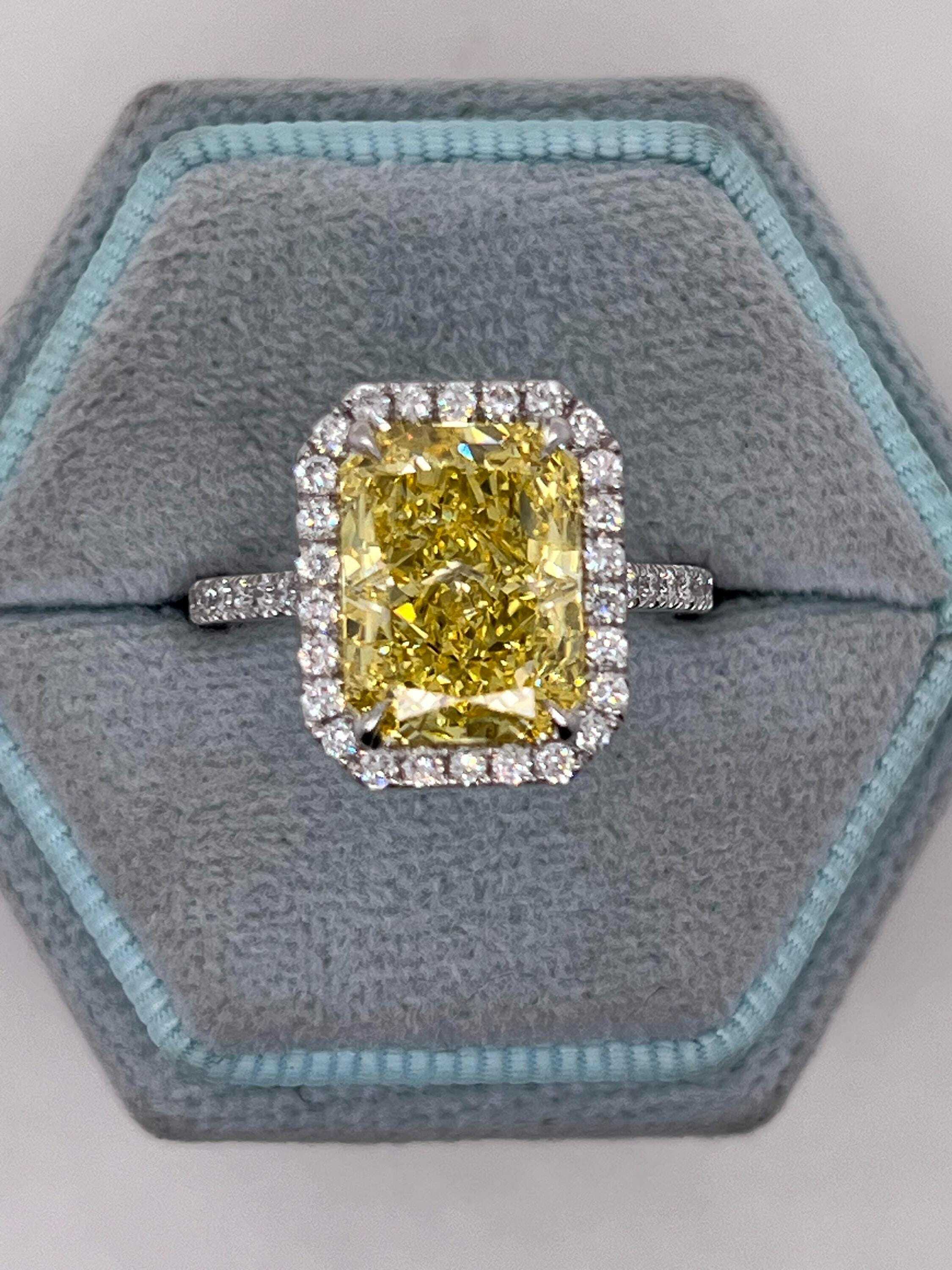 5.5 Carat Total Fancy Vivid Yellow Elongated Radiant Cut Diamond Halo Engagement Ring