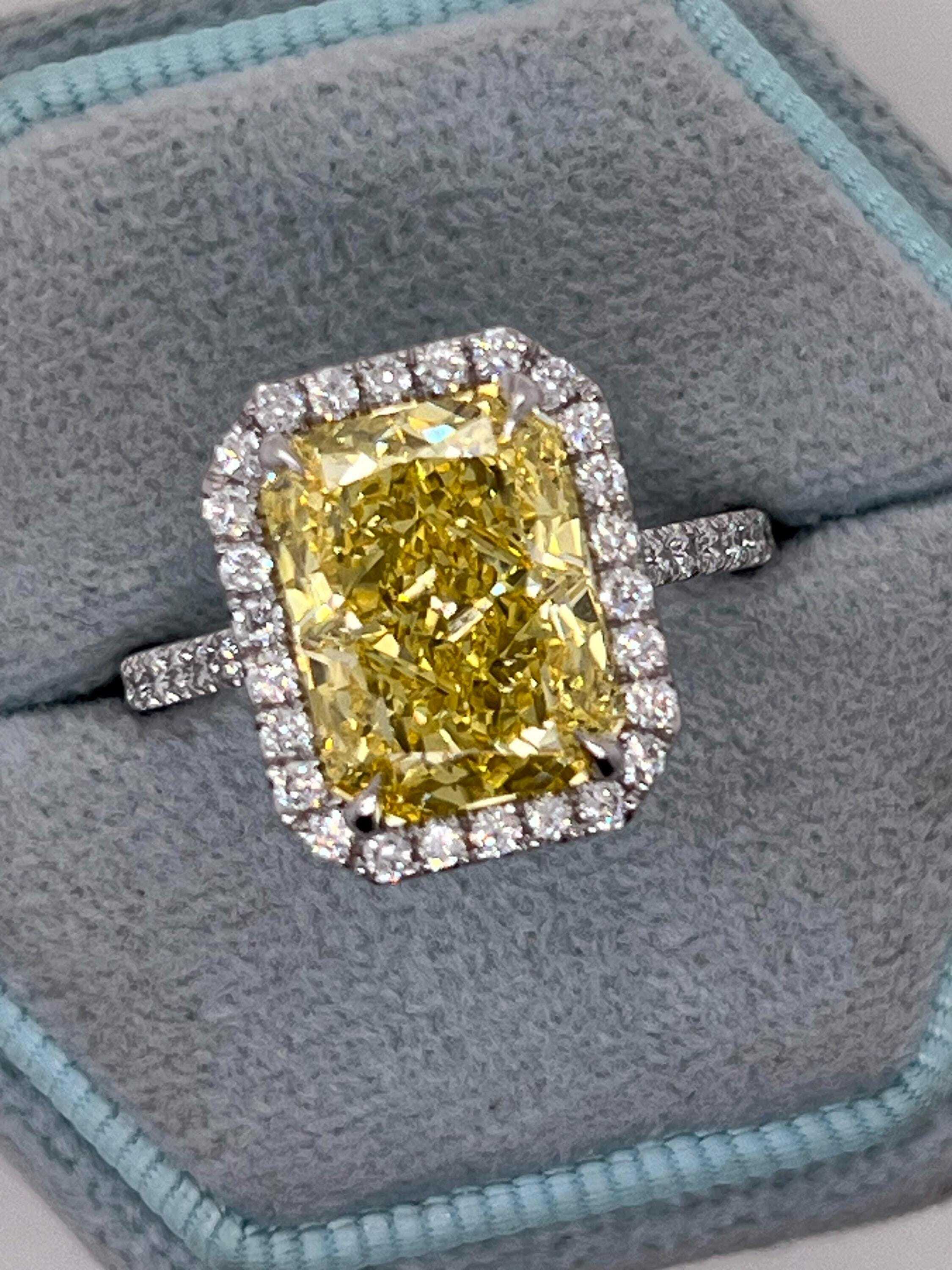 5.5 Carat Total Fancy Vivid Yellow Elongated Radiant Cut Diamond Halo Engagement Ring