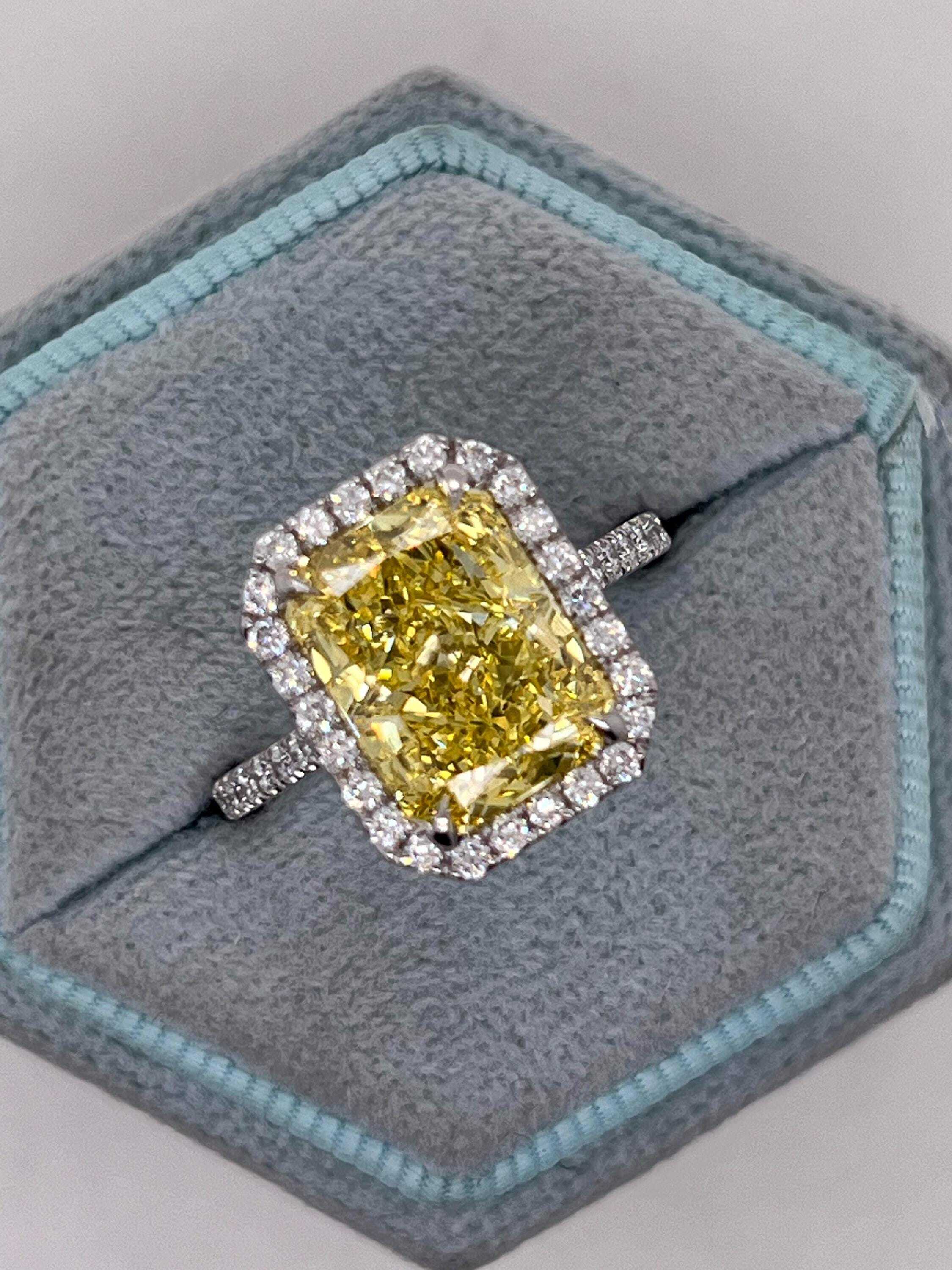 5.5 Carat Total Fancy Vivid Yellow Elongated Radiant Cut Diamond Halo Engagement Ring