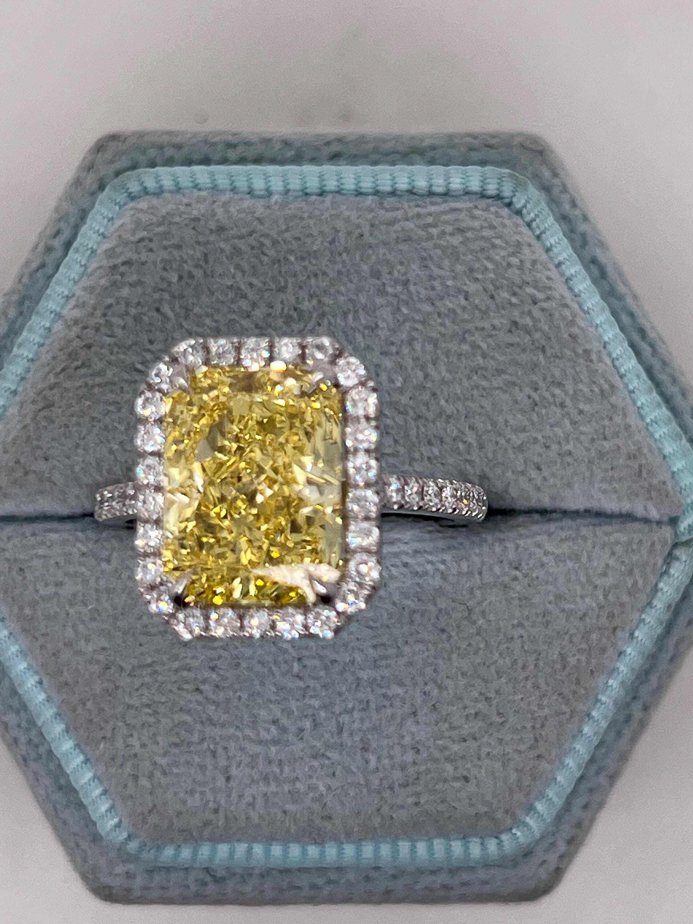 5.5 Carat Total Fancy Vivid Yellow Elongated Radiant Cut Diamond Halo Engagement Ring