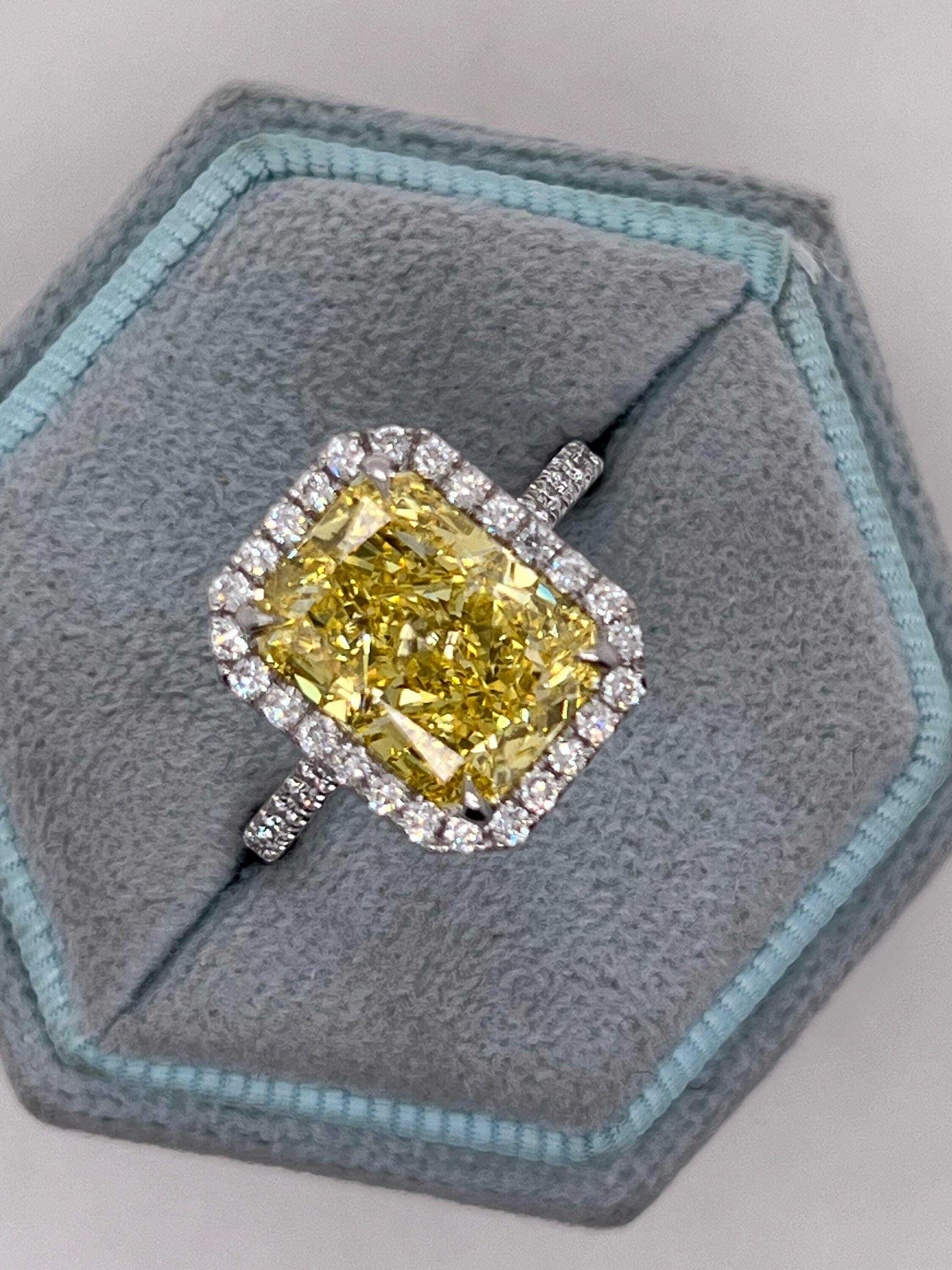 5.5 Carat Total Fancy Vivid Yellow Elongated Radiant Cut Diamond Halo Engagement Ring