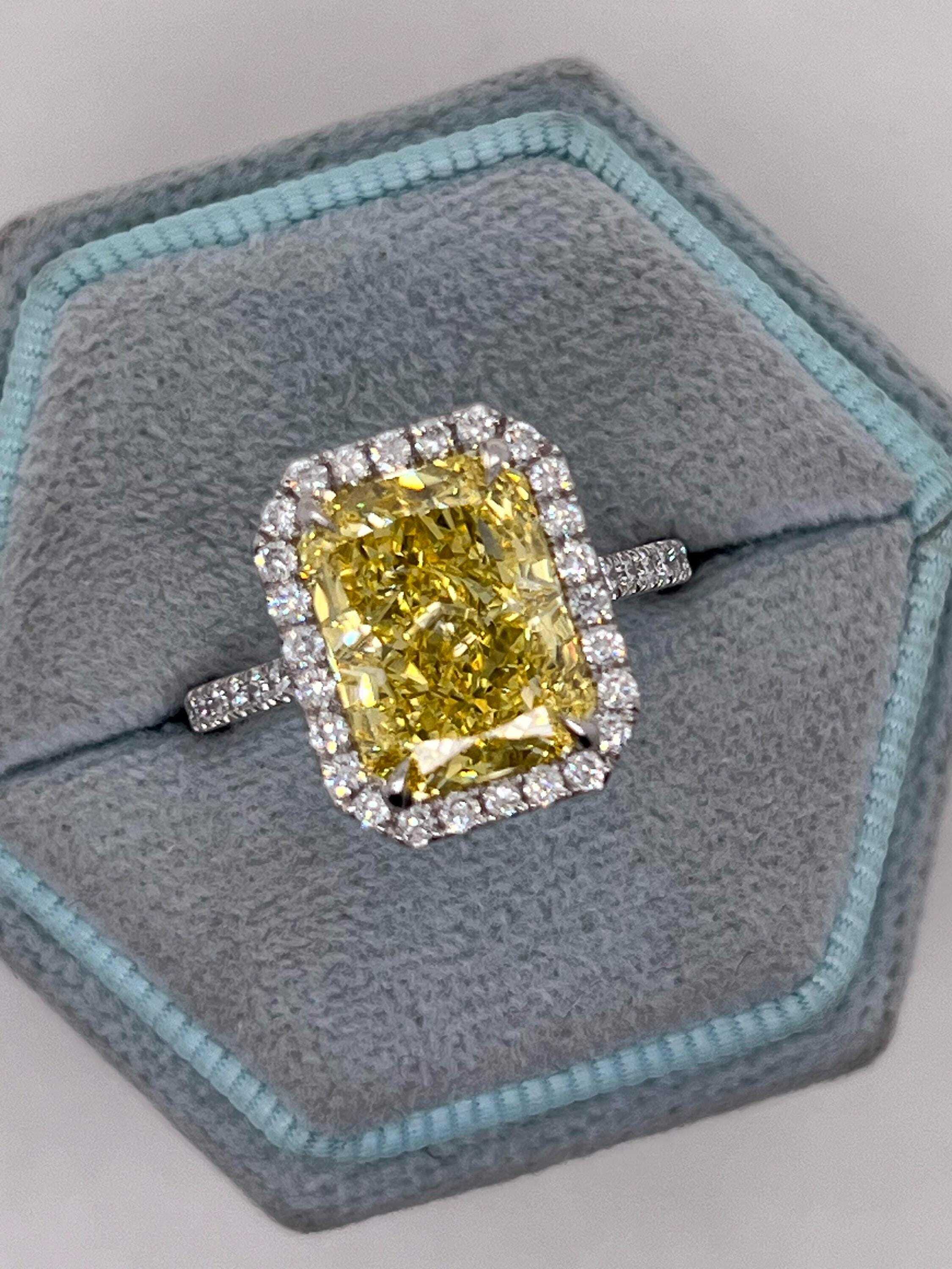 5.5 Carat Total Fancy Vivid Yellow Elongated Radiant Cut Diamond Halo Engagement Ring