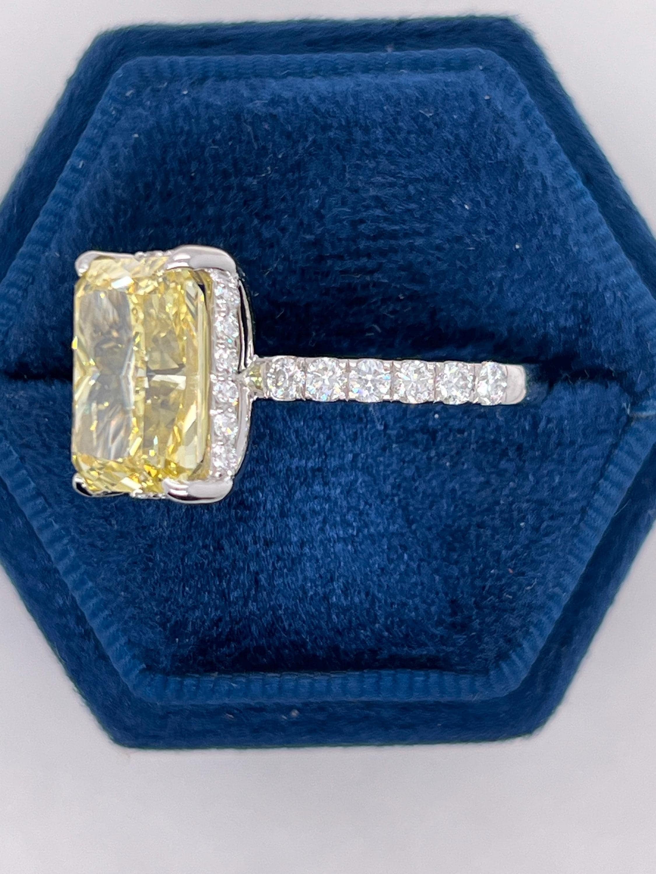7.25 Carat Total Fancy Vivid Yellow VVS1 Clarity Elongated Radiant Cut Diamond Hidden Halo Engagement Ring