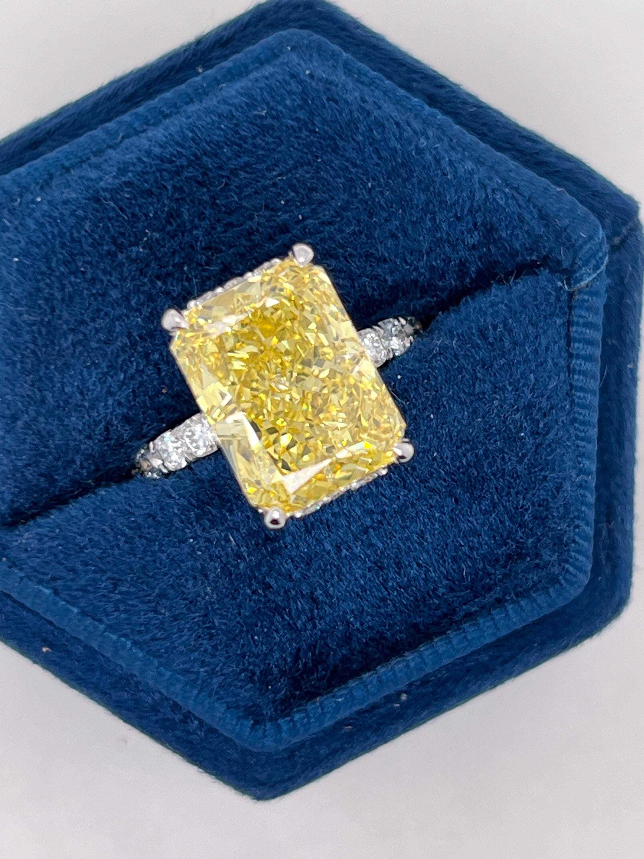 7.25 Carat Total Fancy Vivid Yellow VVS1 Clarity Elongated Radiant Cut Diamond Hidden Halo Engagement Ring