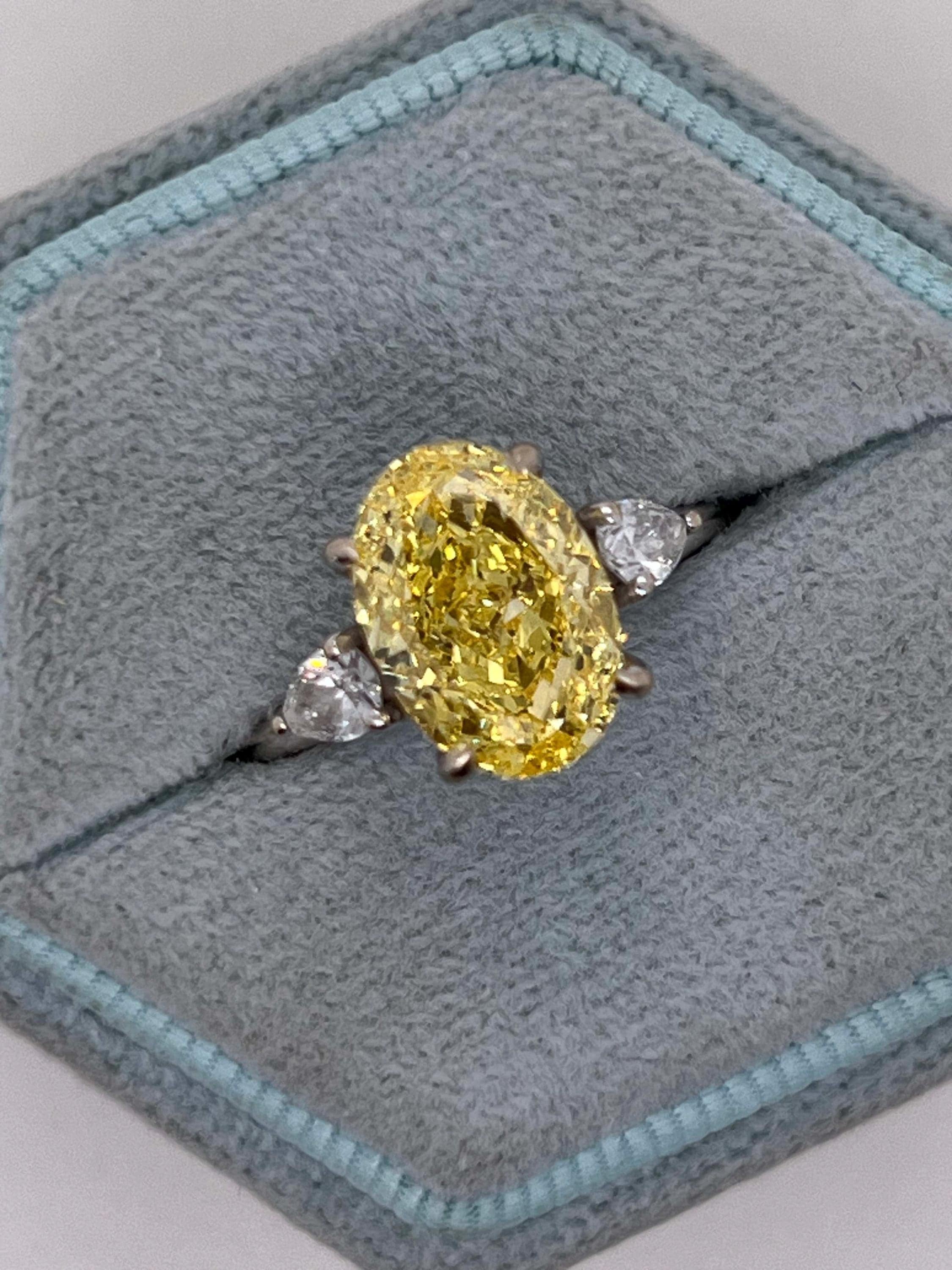4 Carat Fancy Vivid Yellow Oval Cut Diamond Three Stone Engagement Ring Side Pears