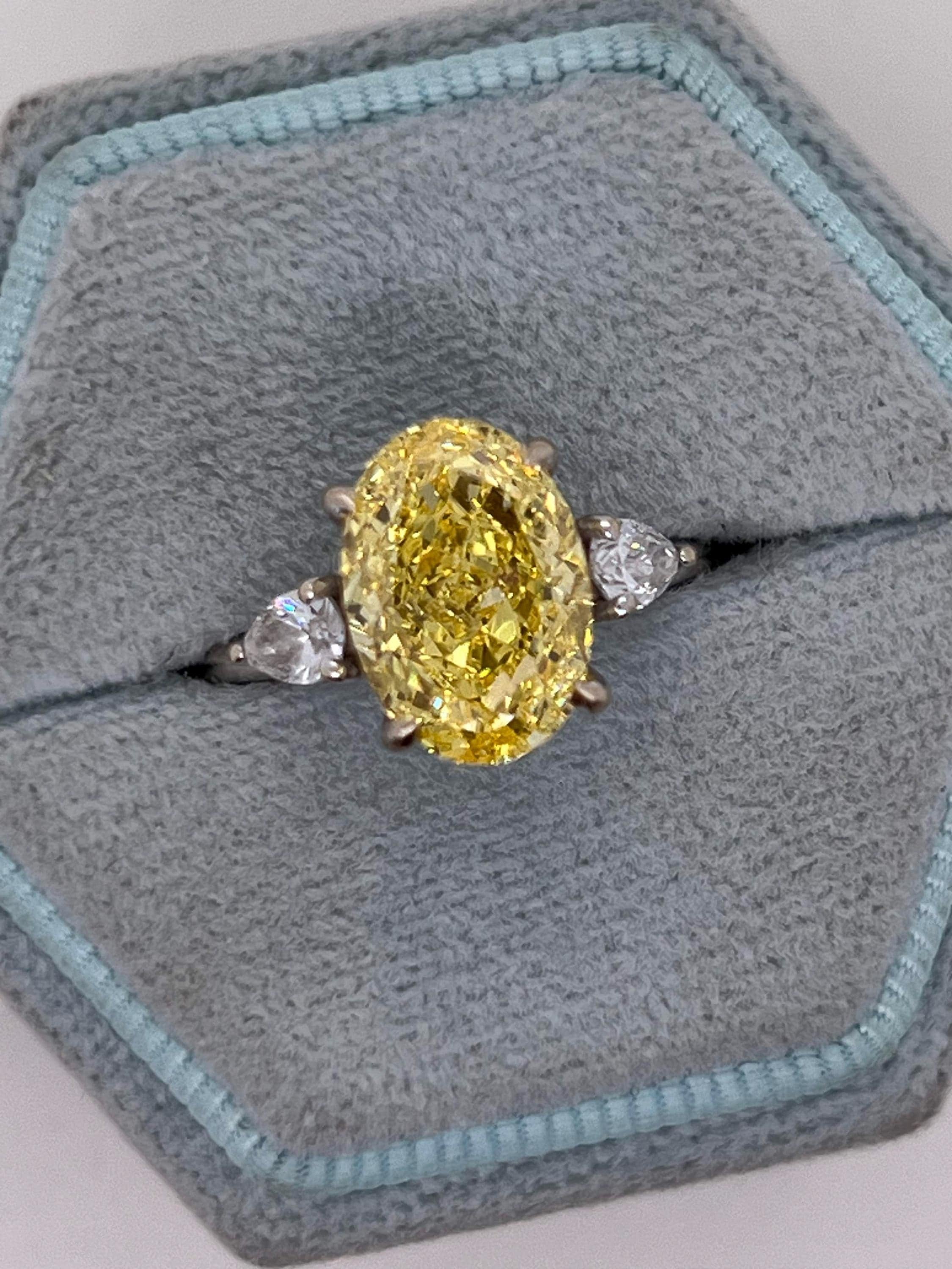 4 Carat Fancy Vivid Yellow Oval Cut Diamond Three Stone Engagement Ring Side Pears