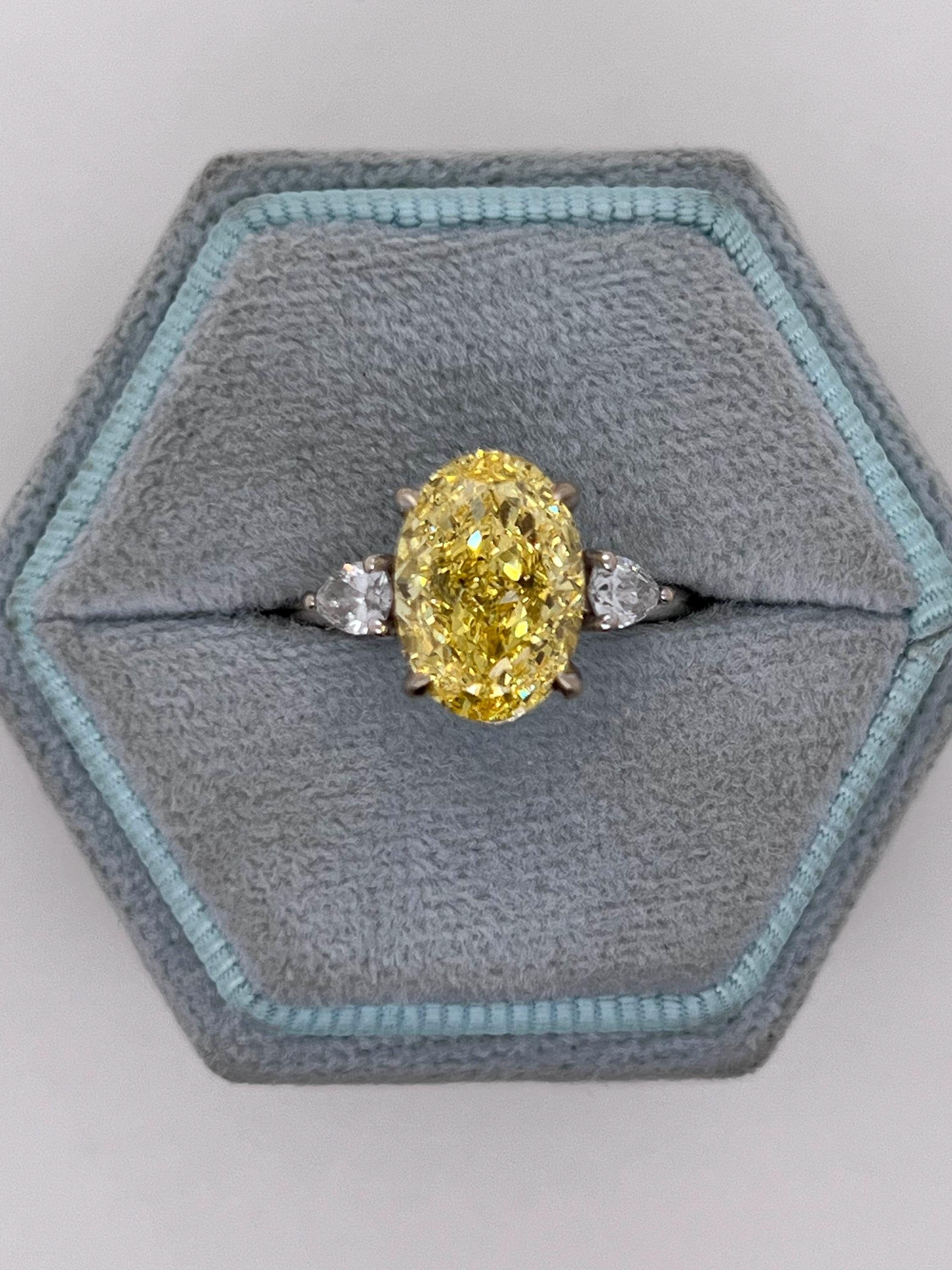 4 Carat Fancy Vivid Yellow Oval Cut Diamond Three Stone Engagement Ring Side Pears