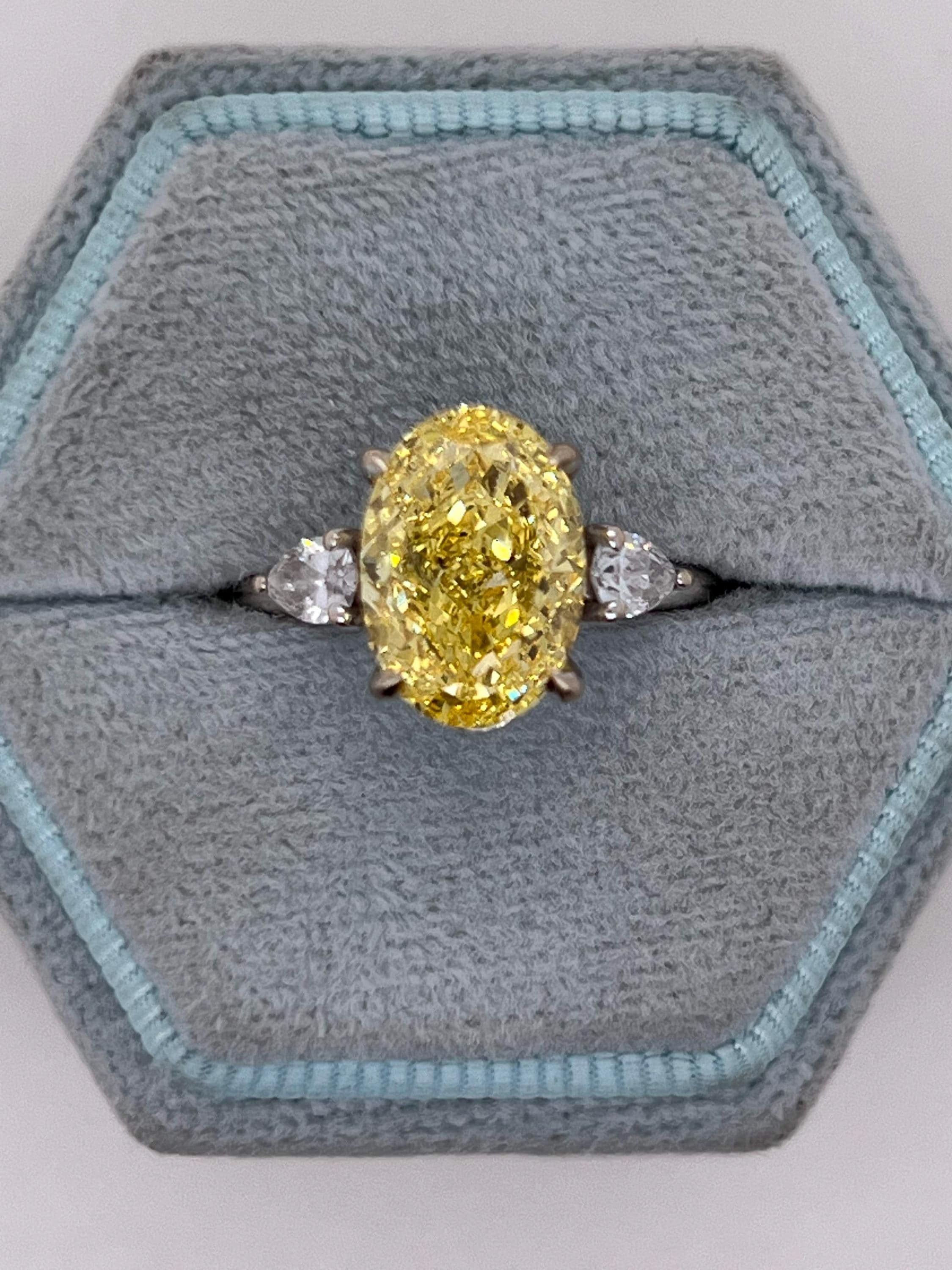 4 Carat Fancy Vivid Yellow Oval Cut Diamond Three Stone Engagement Ring Side Pears