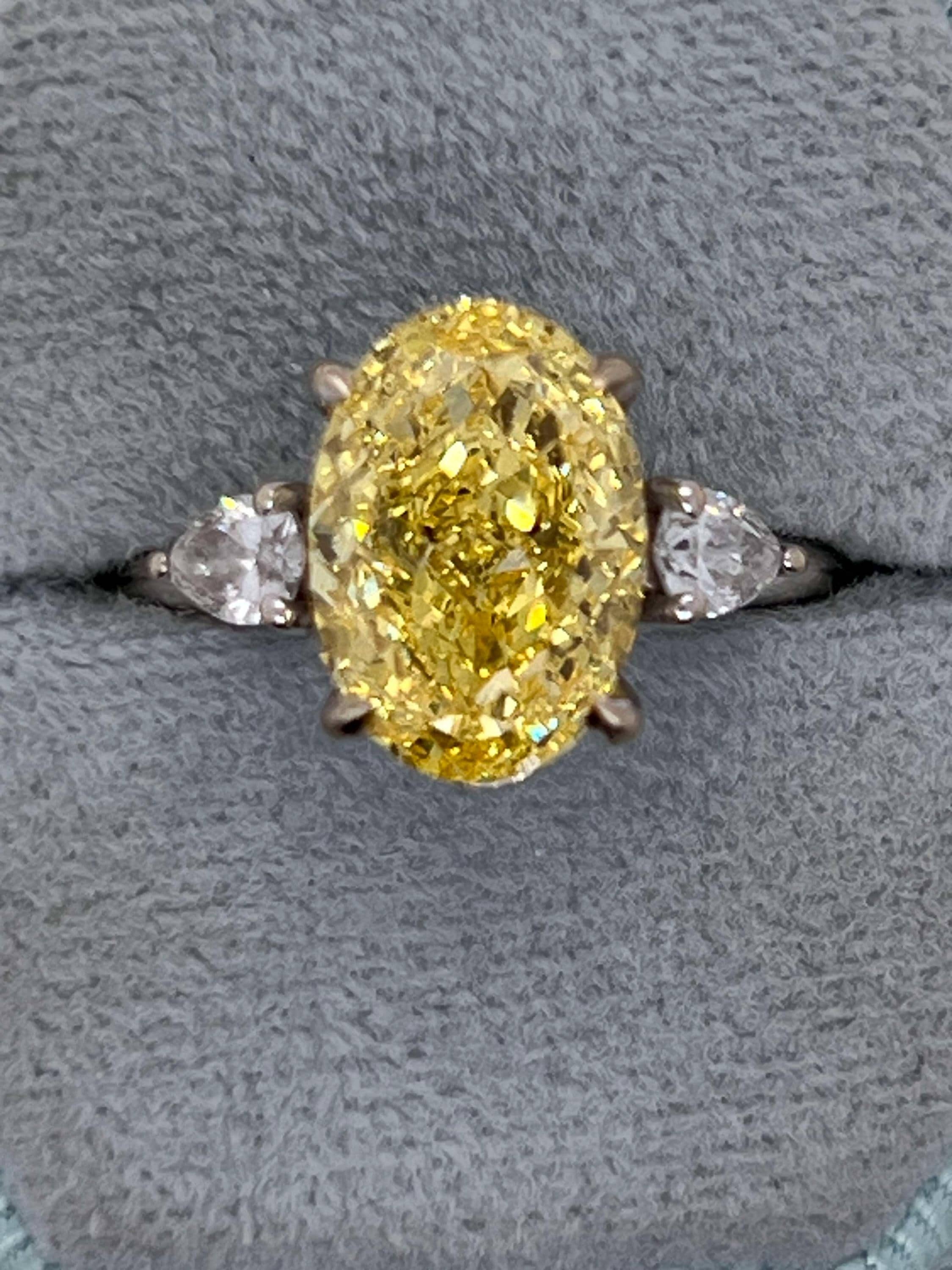 4 Carat Fancy Vivid Yellow Oval Cut Diamond Three Stone Engagement Ring Side Pears