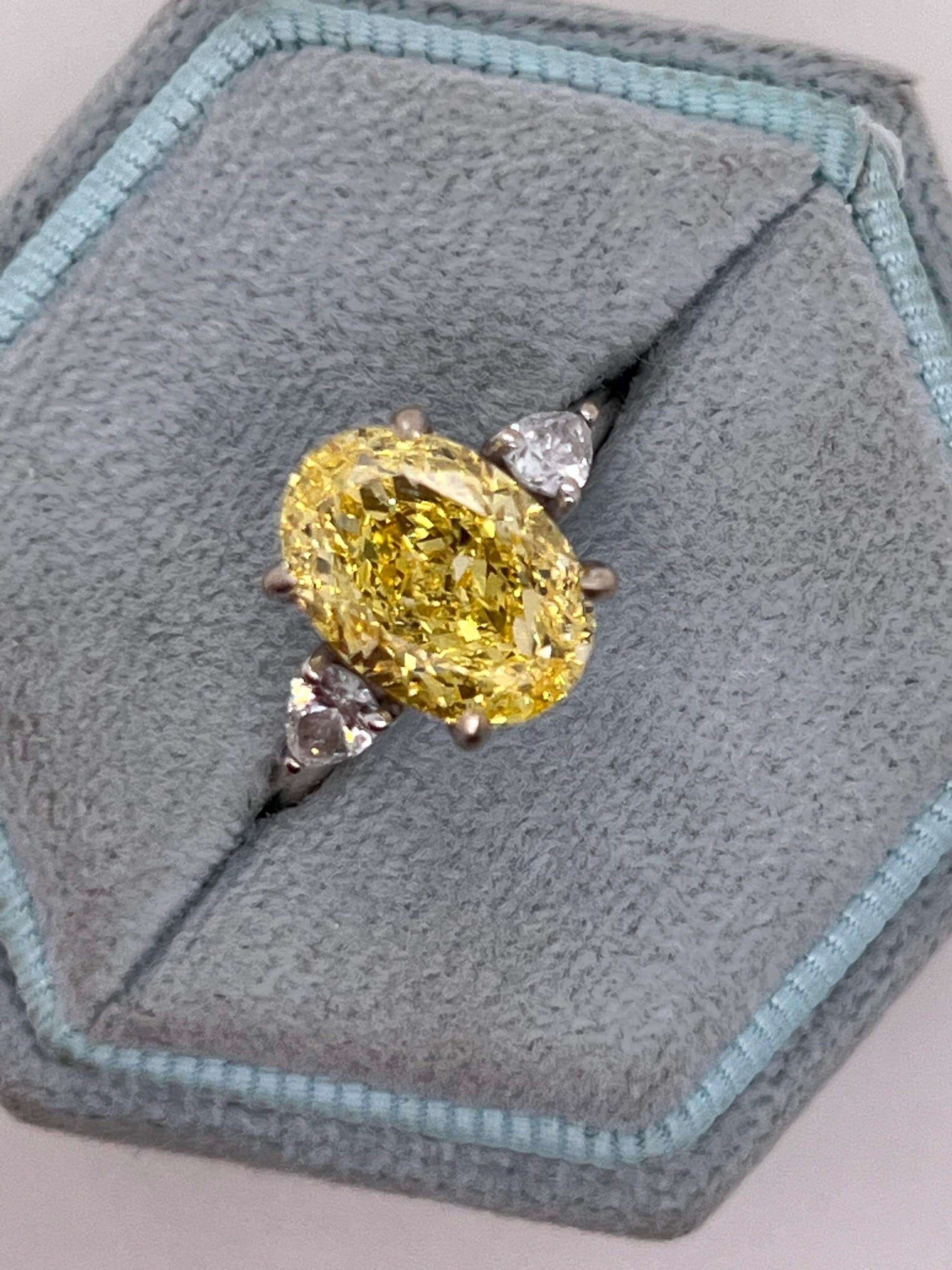 4 Carat Fancy Vivid Yellow Oval Cut Diamond Three Stone Engagement Ring Side Pears