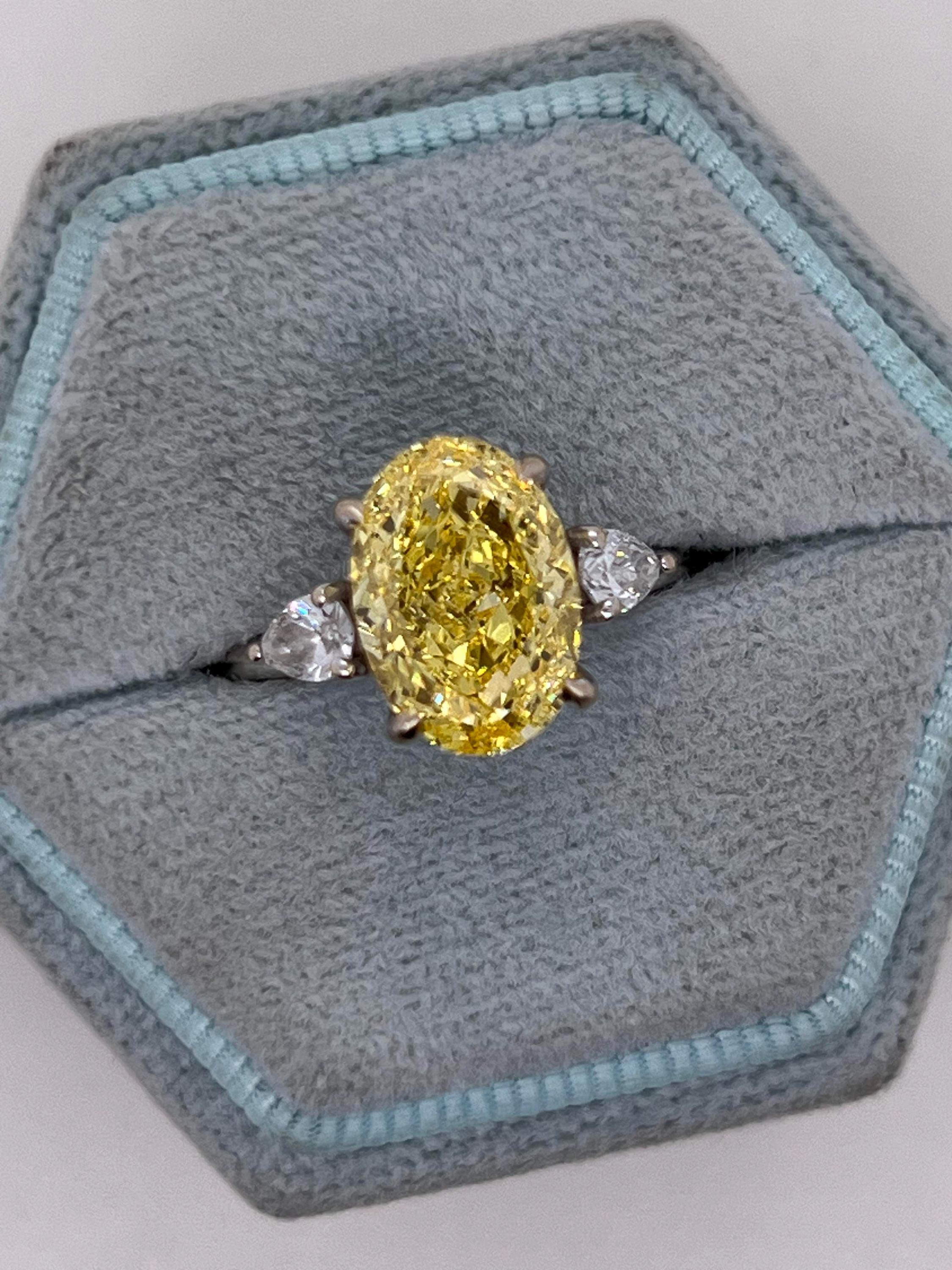 4 Carat Fancy Vivid Yellow Oval Cut Diamond Three Stone Engagement Ring Side Pears