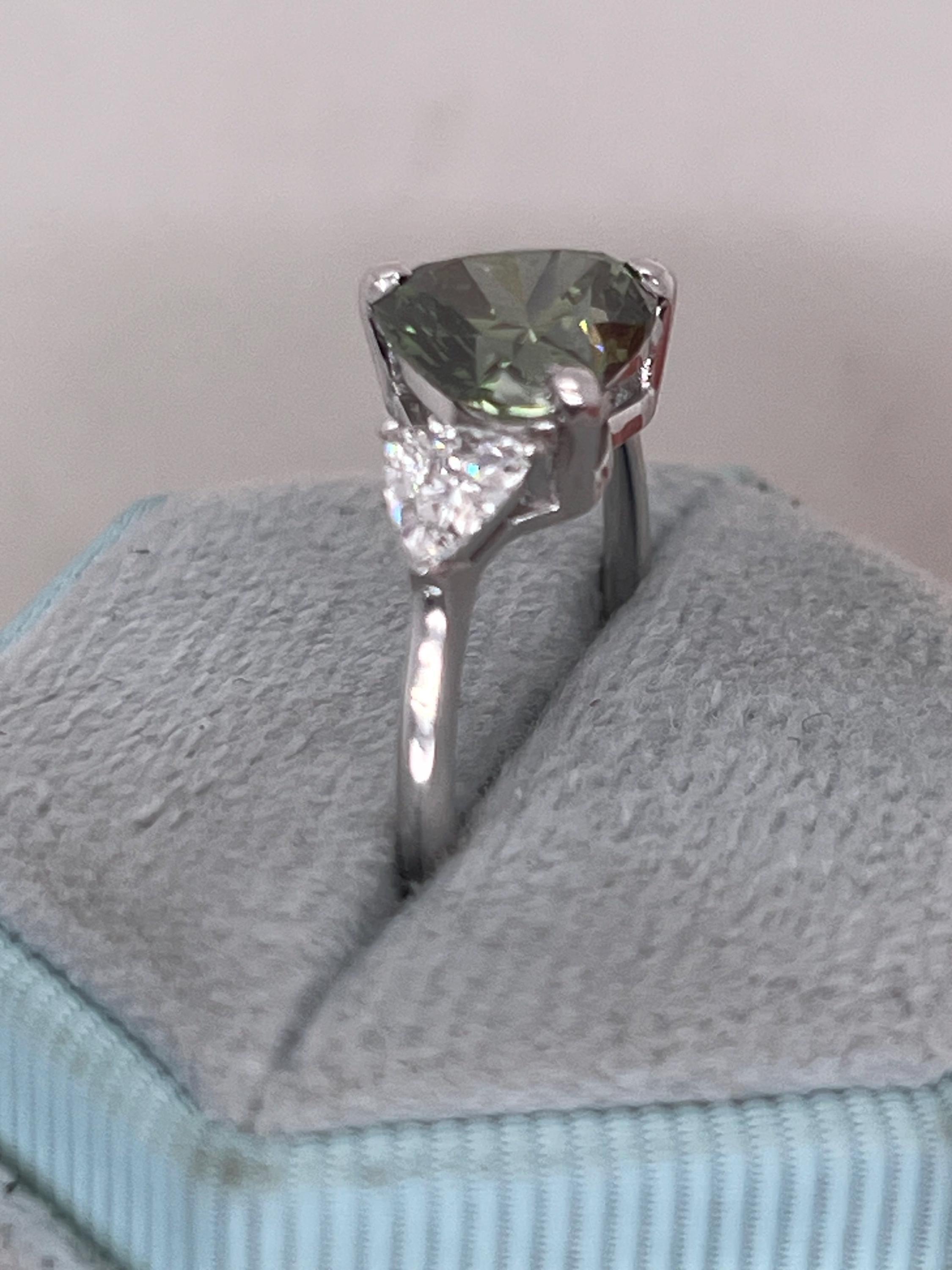 2.75 Carat Fancy Vivid Green Heart Cut Diamond Three Stone Engagement Ring Side Trillions