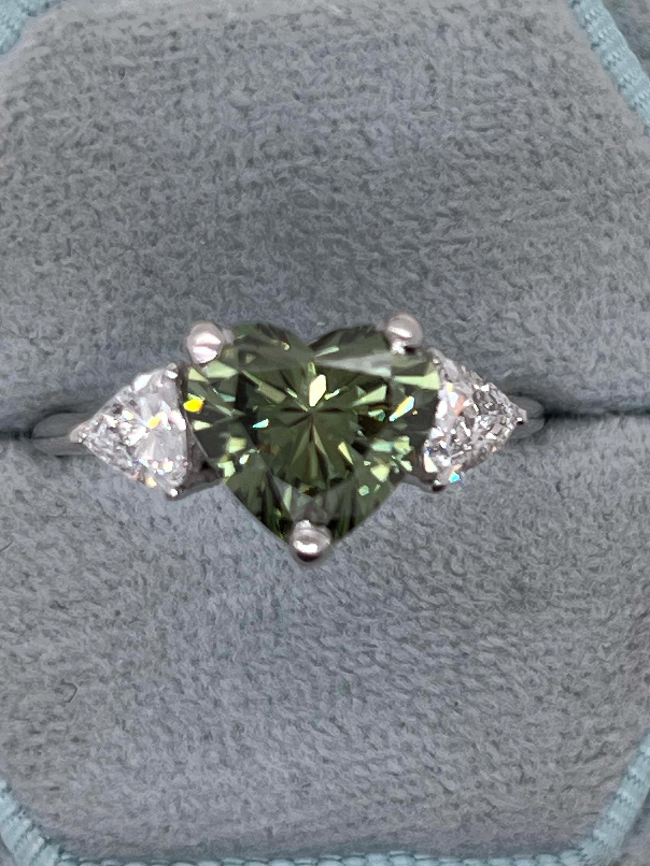 2.75 Carat Fancy Vivid Green Heart Cut Diamond Three Stone Engagement Ring Side Trillions