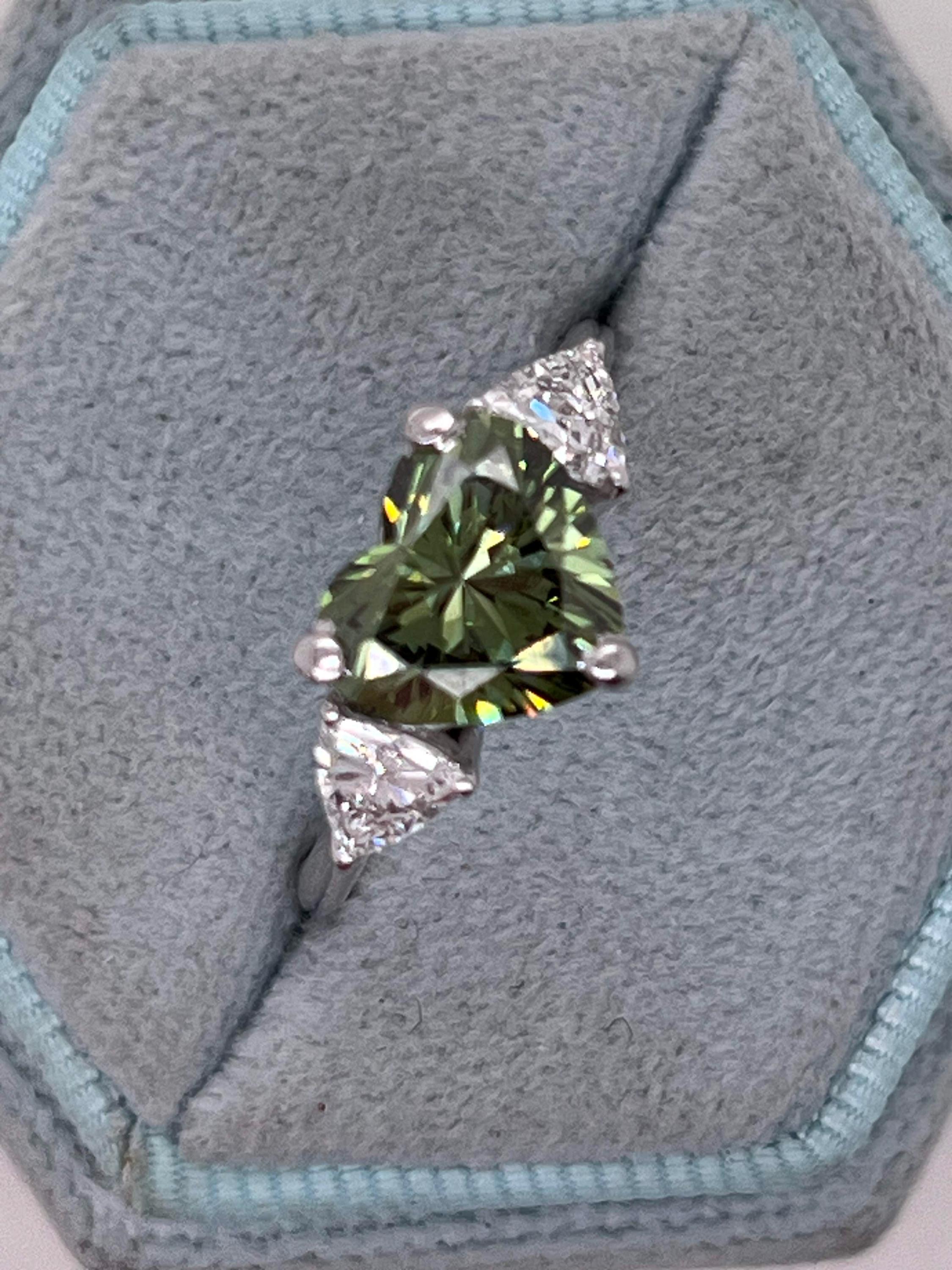 2.75 Carat Fancy Vivid Green Heart Cut Diamond Three Stone Engagement Ring Side Trillions