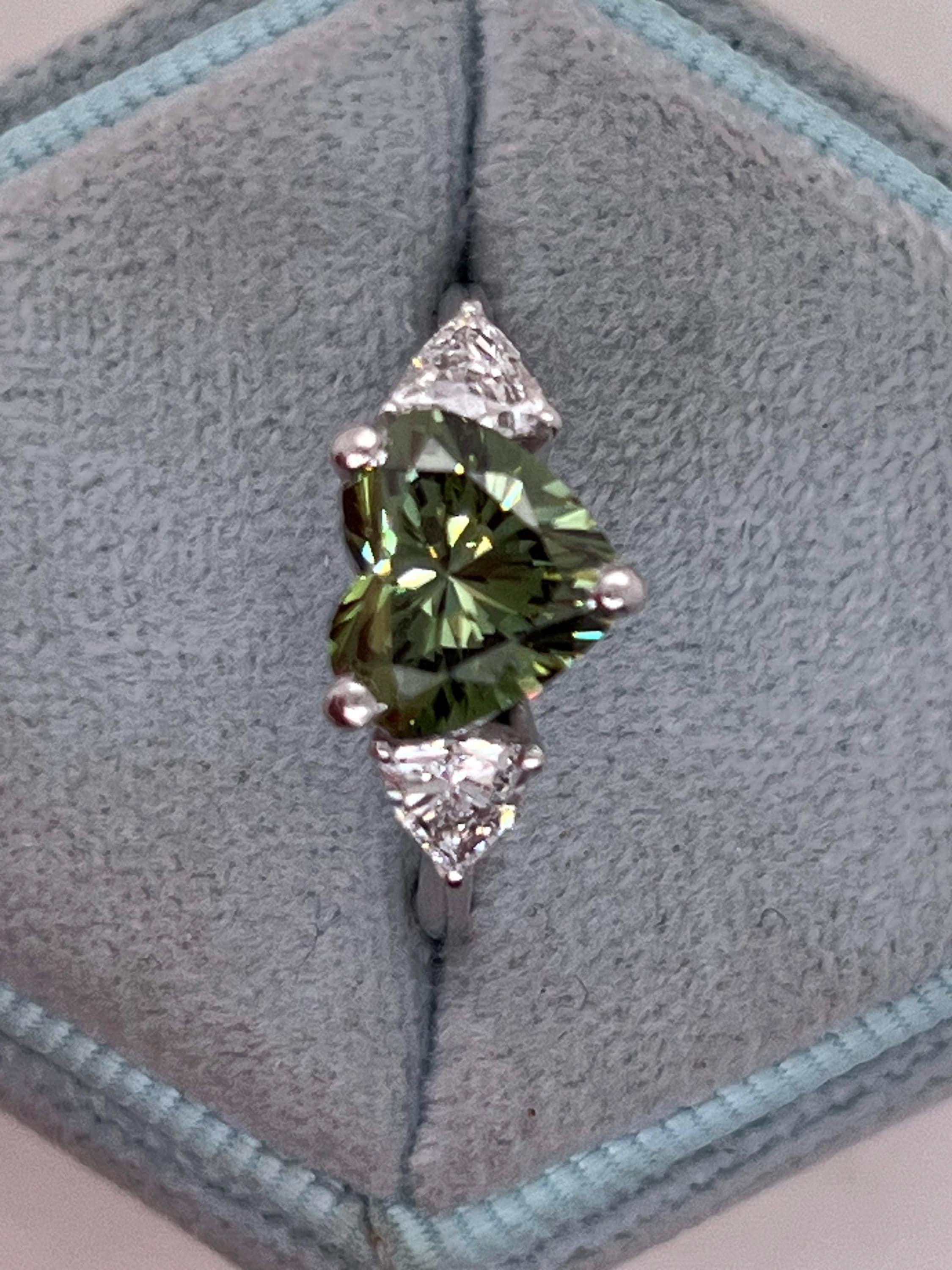 2.75 Carat Fancy Vivid Green Heart Cut Diamond Three Stone Engagement Ring Side Trillions