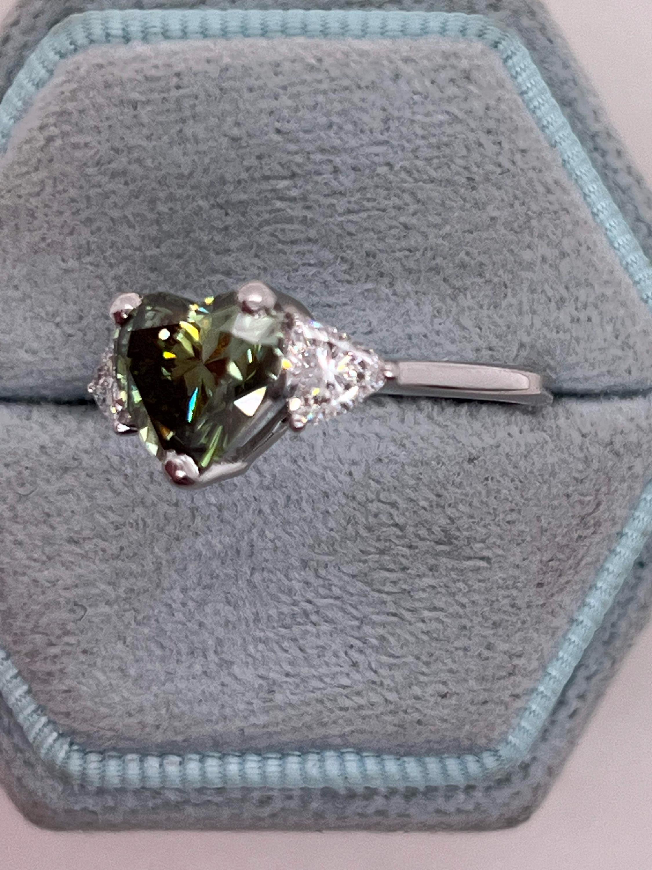 2.75 Carat Fancy Vivid Green Heart Cut Diamond Three Stone Engagement Ring Side Trillions