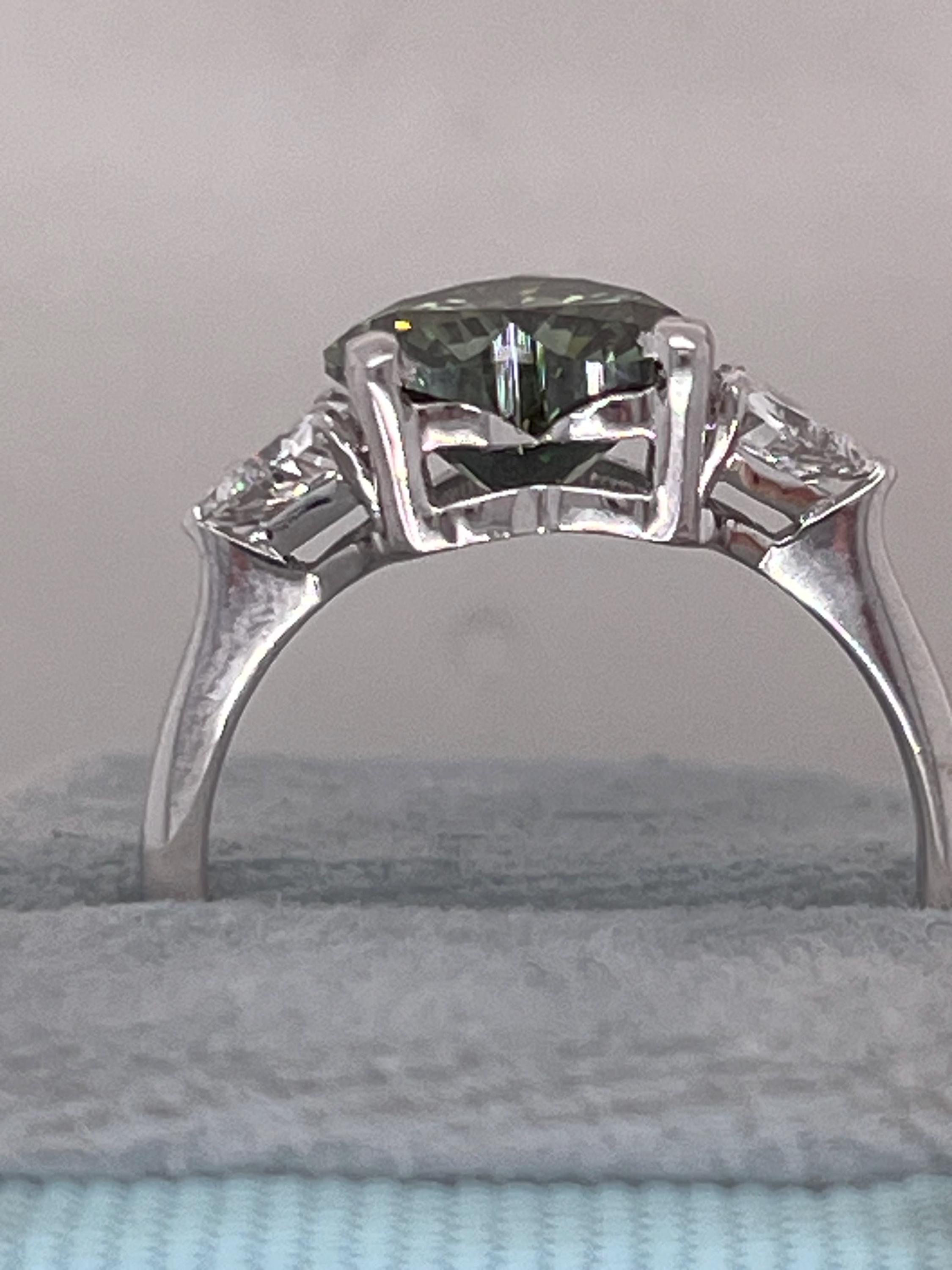 2.75 Carat Fancy Vivid Green Heart Cut Diamond Three Stone Engagement Ring Side Trillions